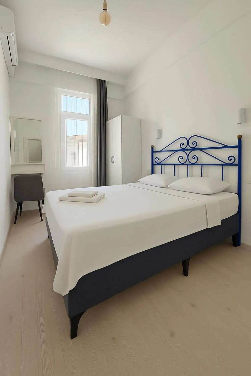 Bed in R HOUSE HOTEL