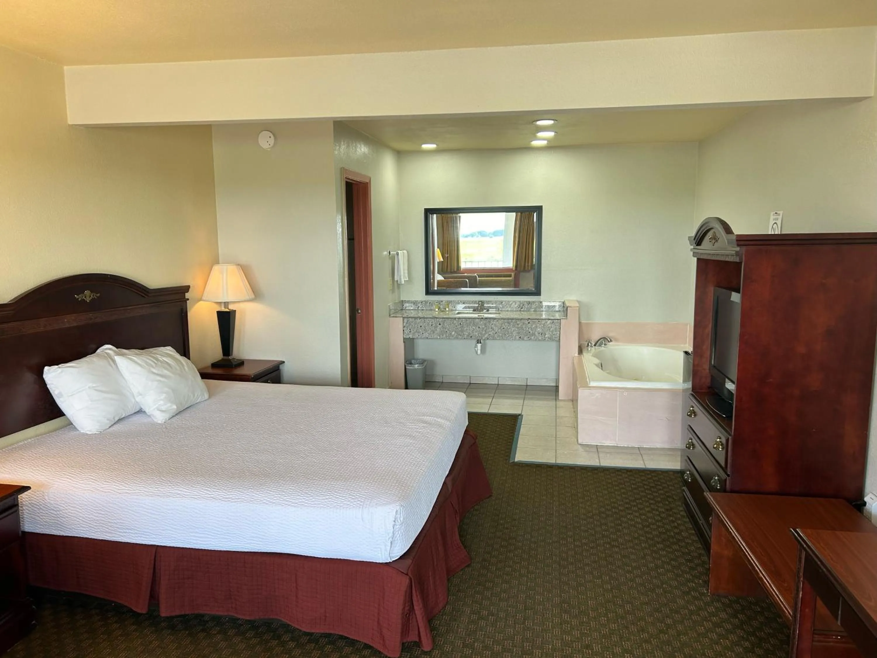 Bed in Howards Inn Motel