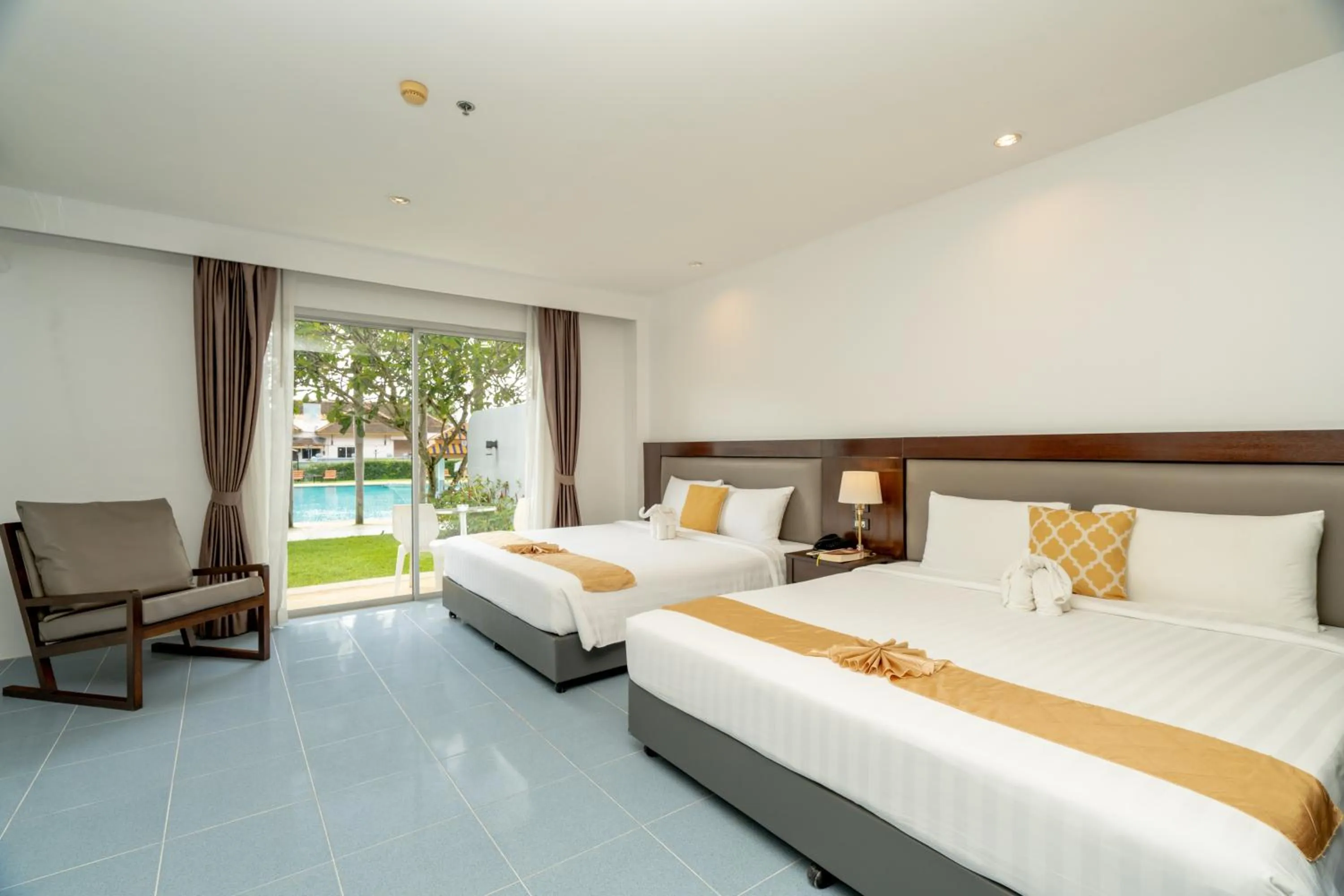 Pool view, Bed in Blue Beach Grand Resort And Spa