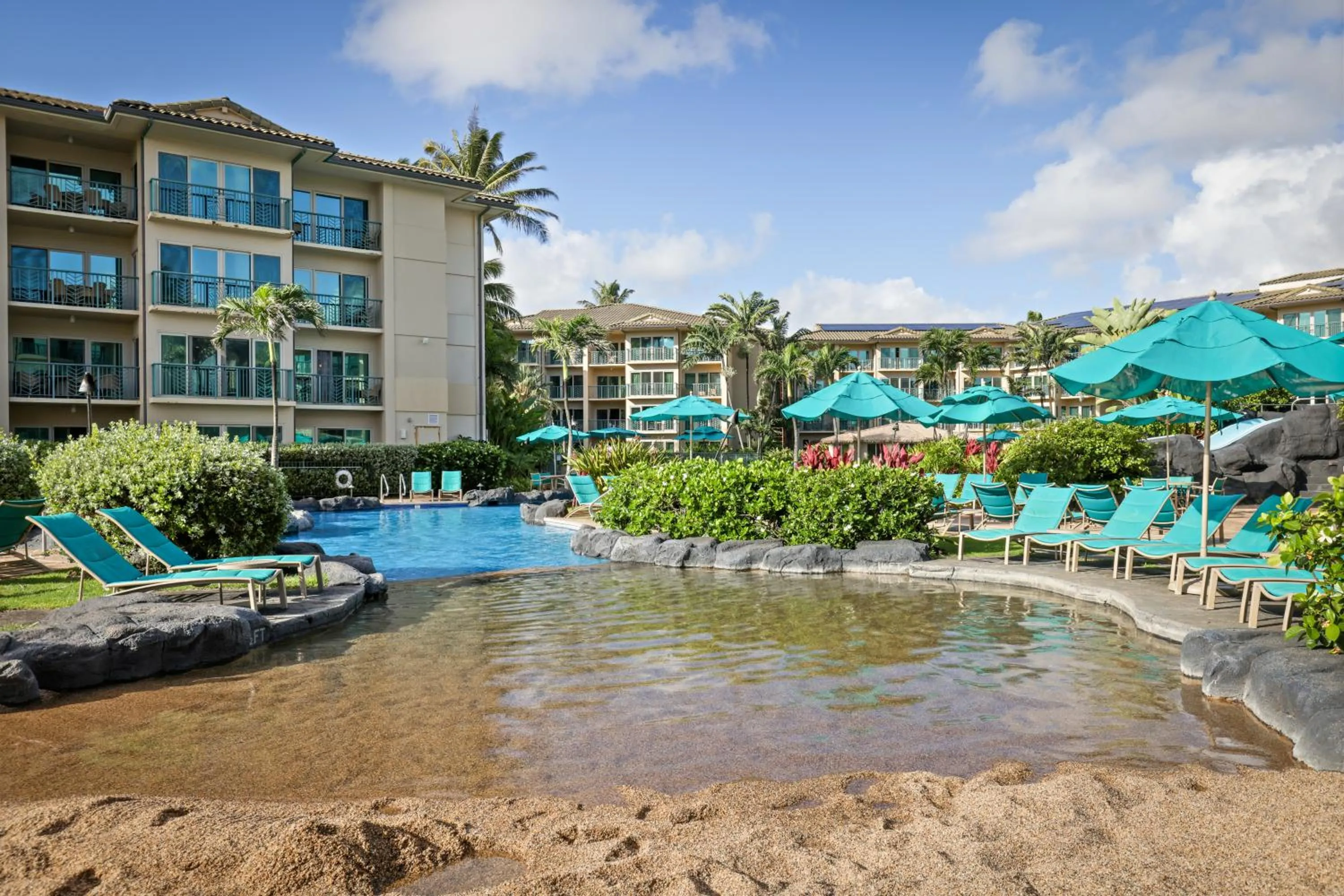 Swimming pool in Waipouli Beach Resort and Spa Kauai by OUTRIGGER