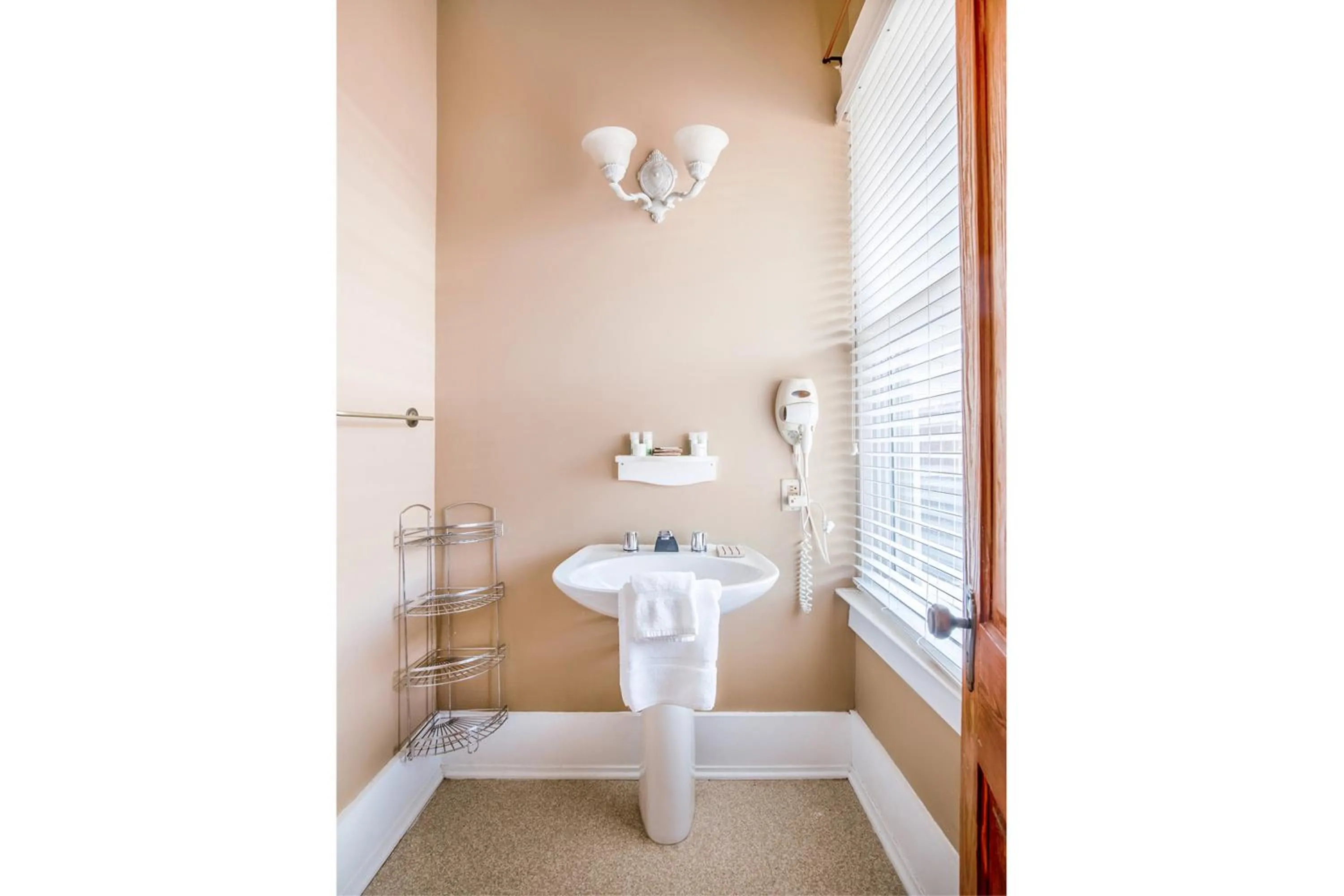 Bathroom in The Belmont Inn by OYO