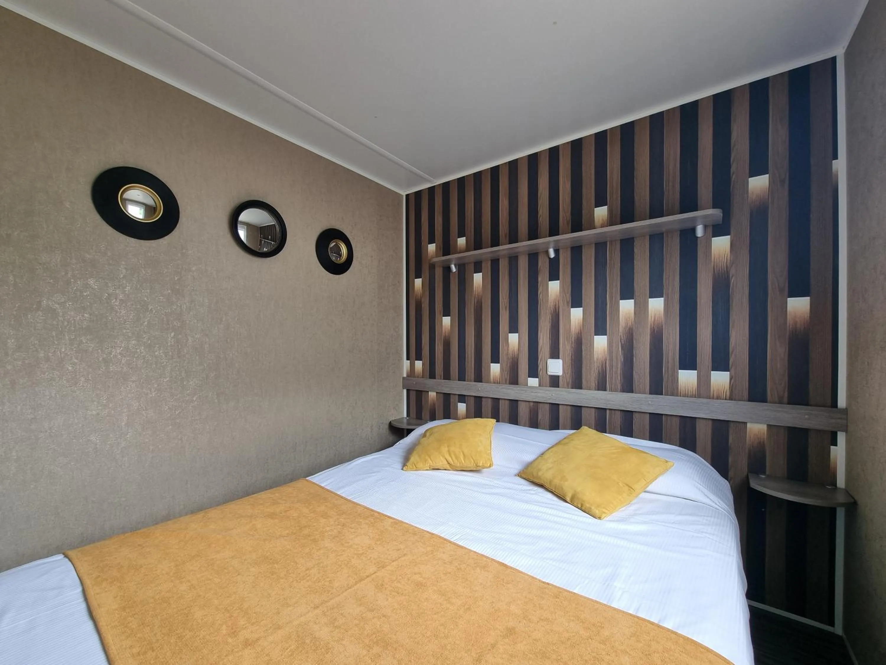 Bed in Hôtel du Moulin de la Brevette