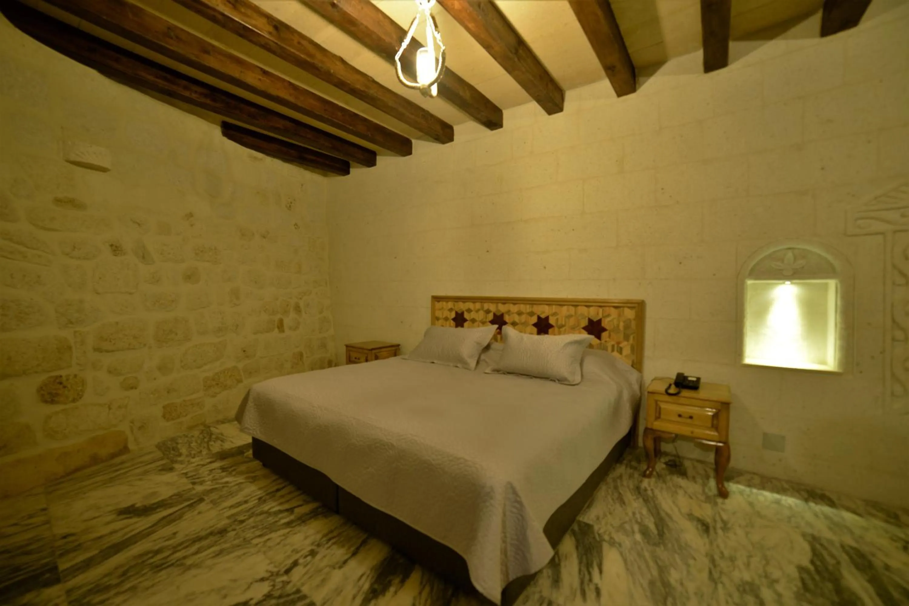 Bed in Crassus Cave Hotel