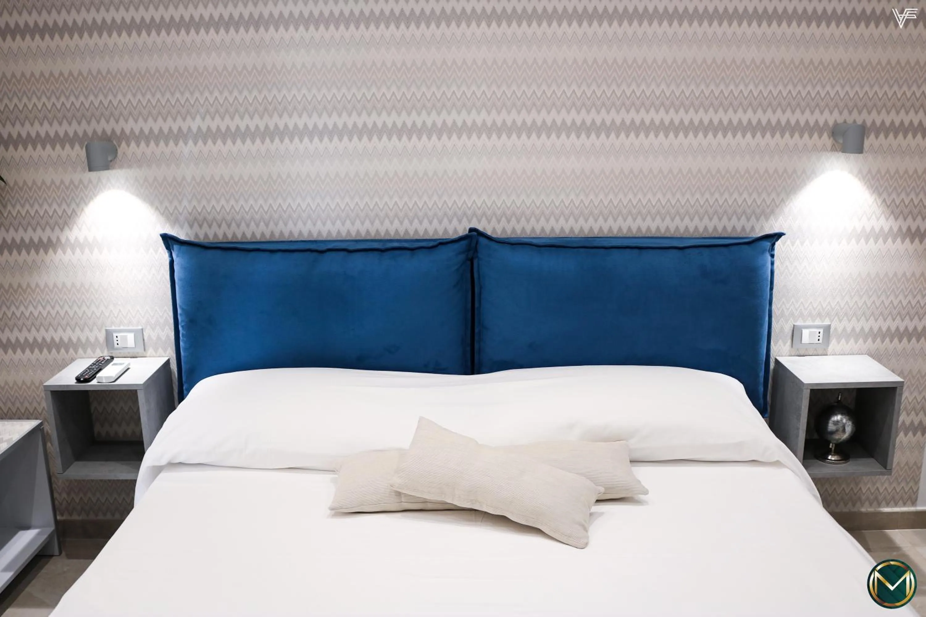 Bed in MARGHERITA BOUTIQUE ROOMS