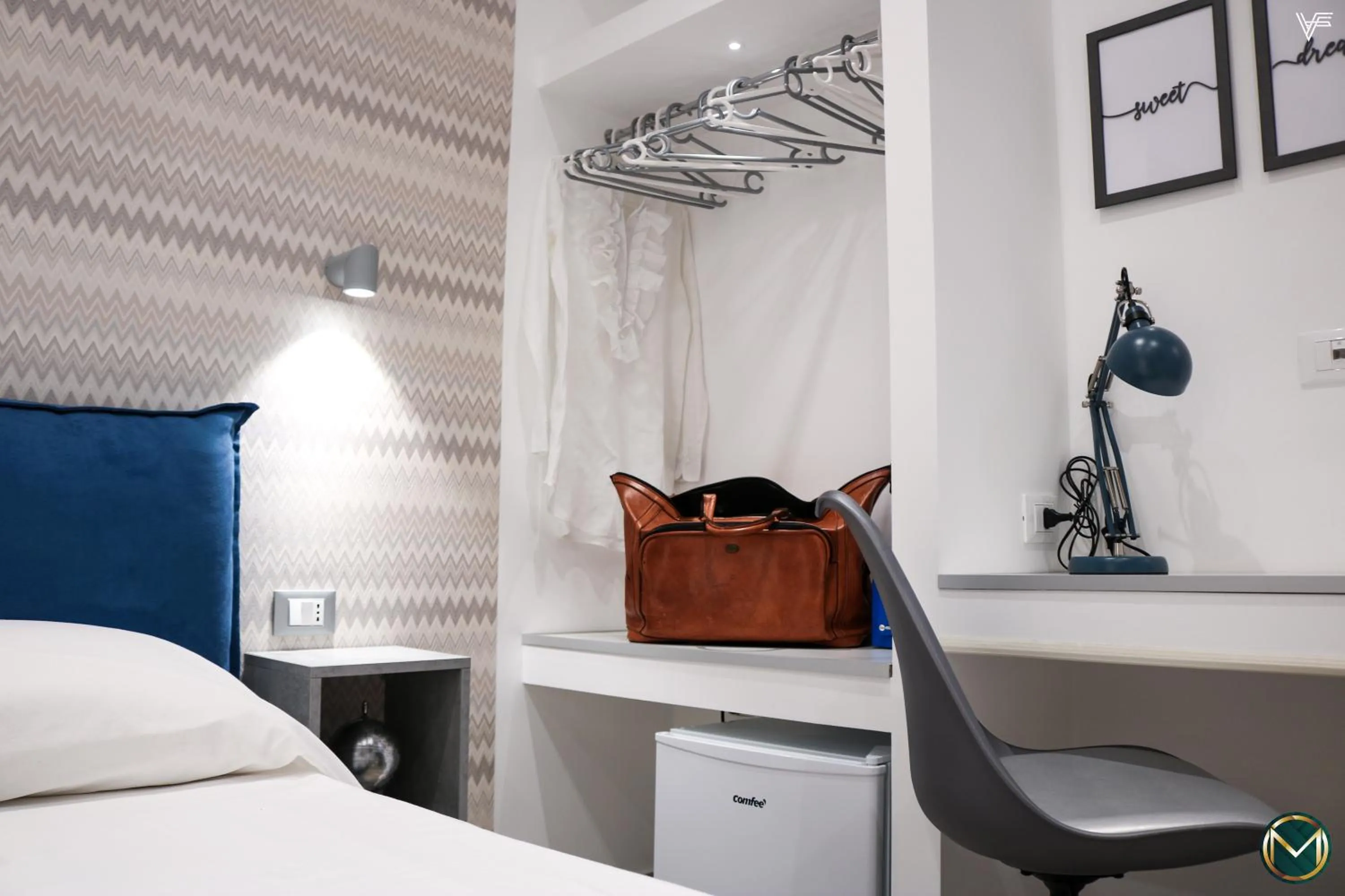 Bed in MARGHERITA BOUTIQUE ROOMS