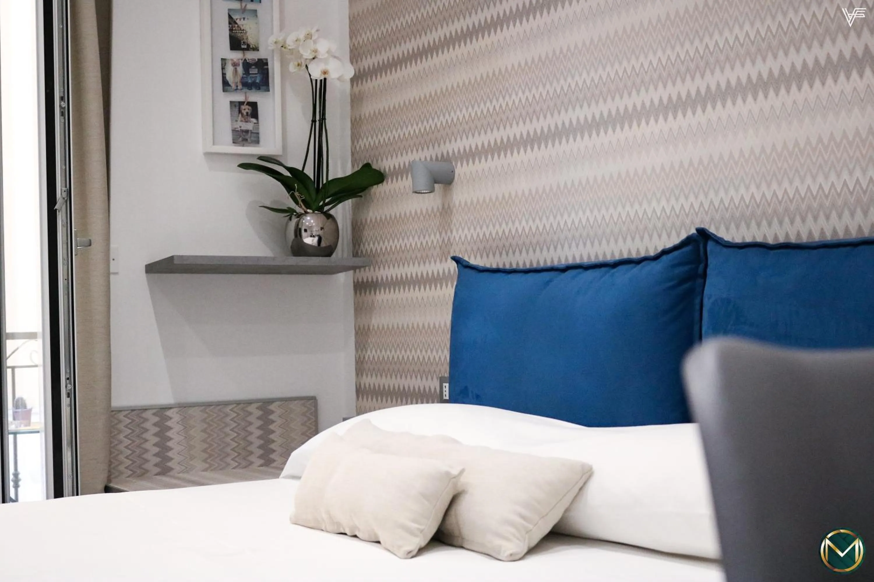 Bed in MARGHERITA BOUTIQUE ROOMS