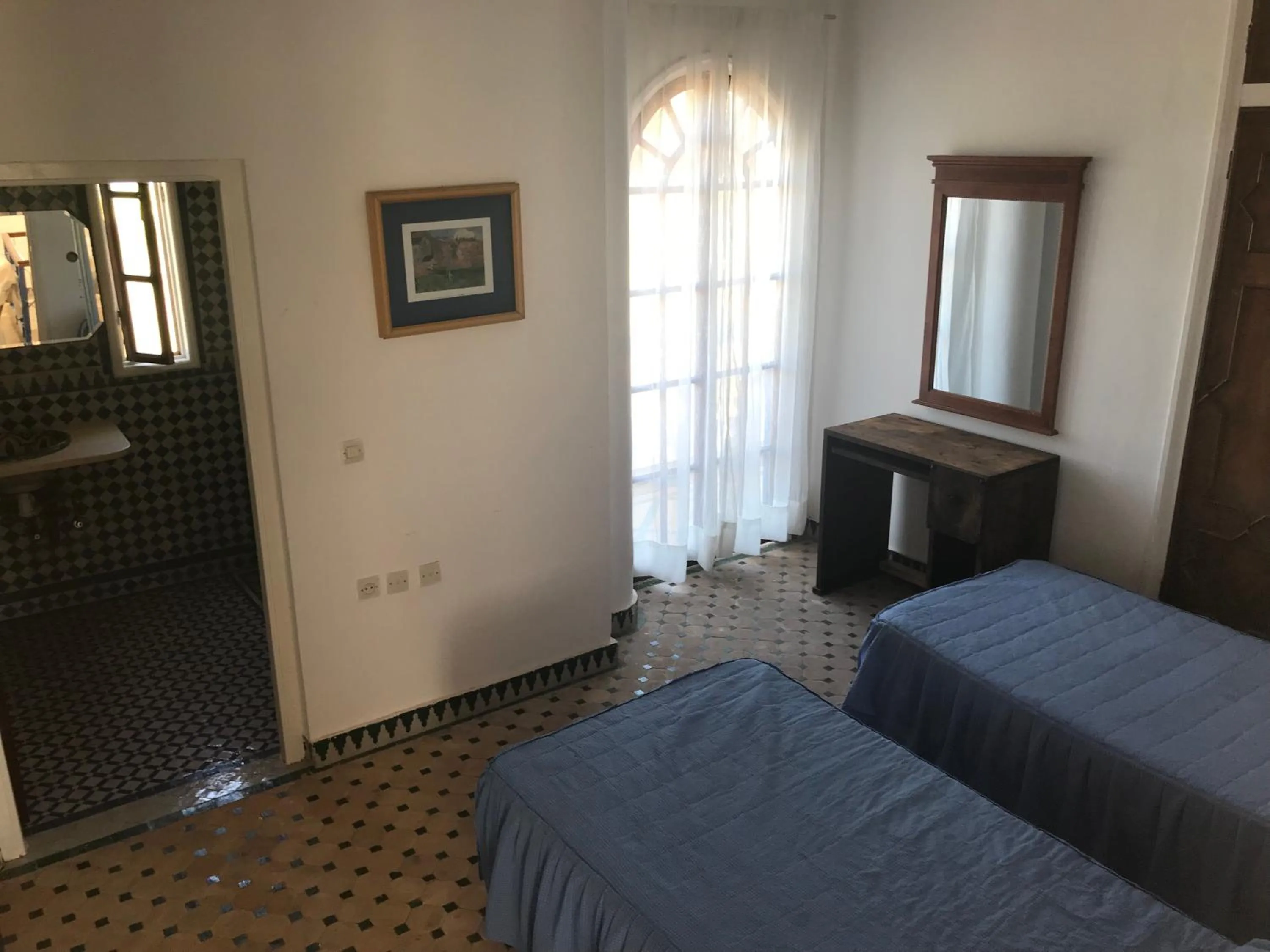 Bed in RIAD DES OISEAUX