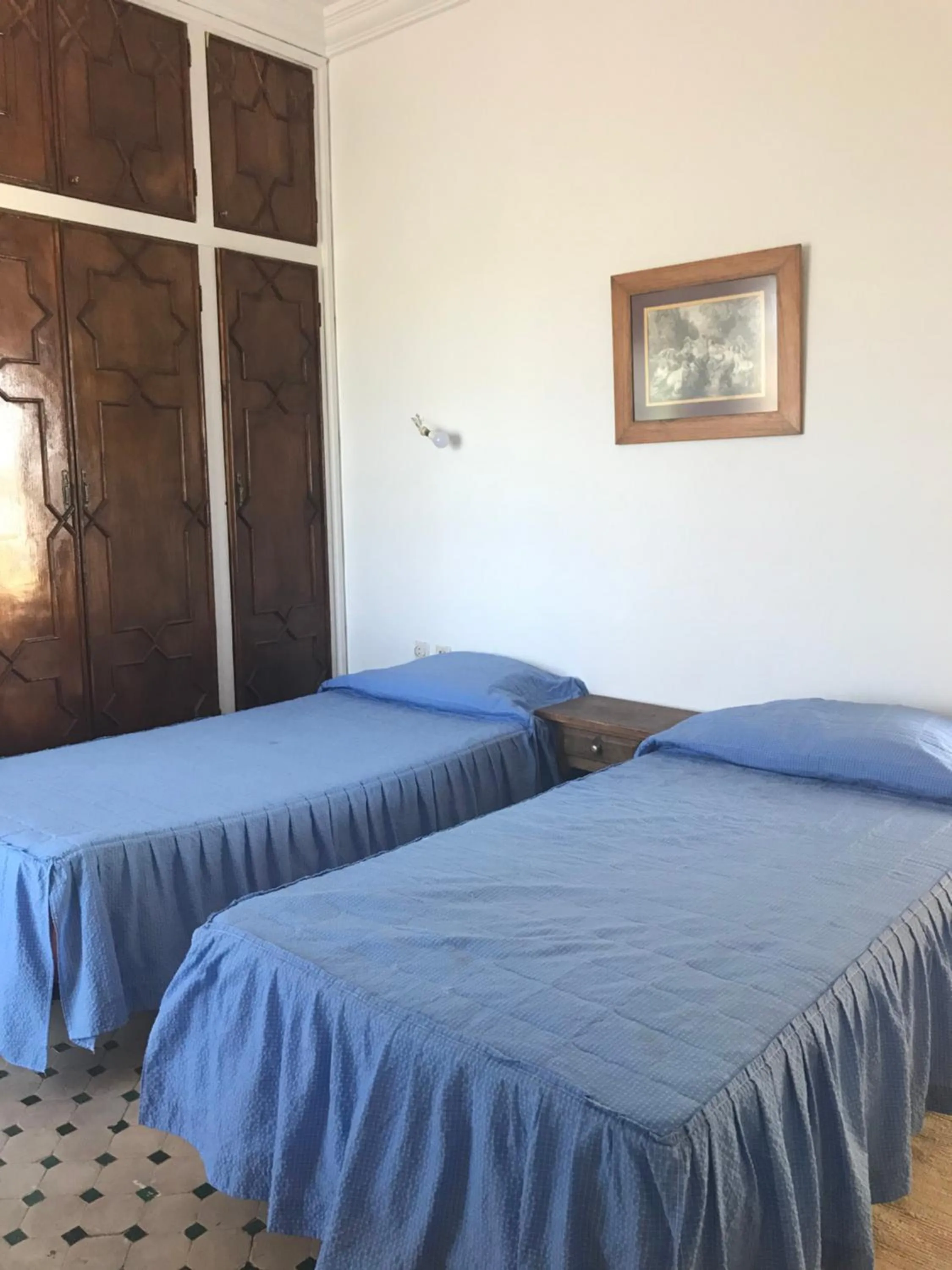 Bed in RIAD DES OISEAUX