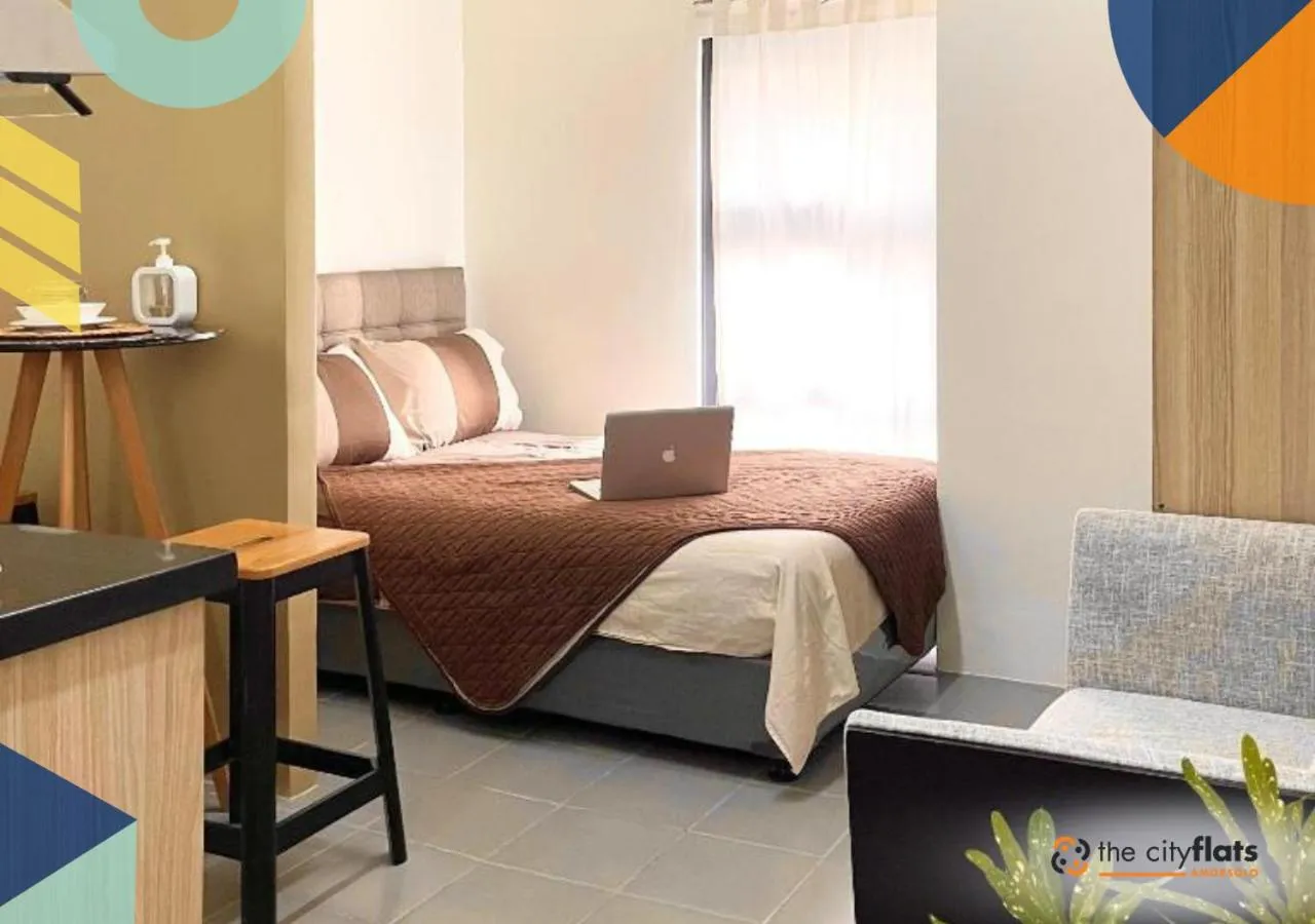 Photo of the whole room, Bed in The City Flats Amorsolo