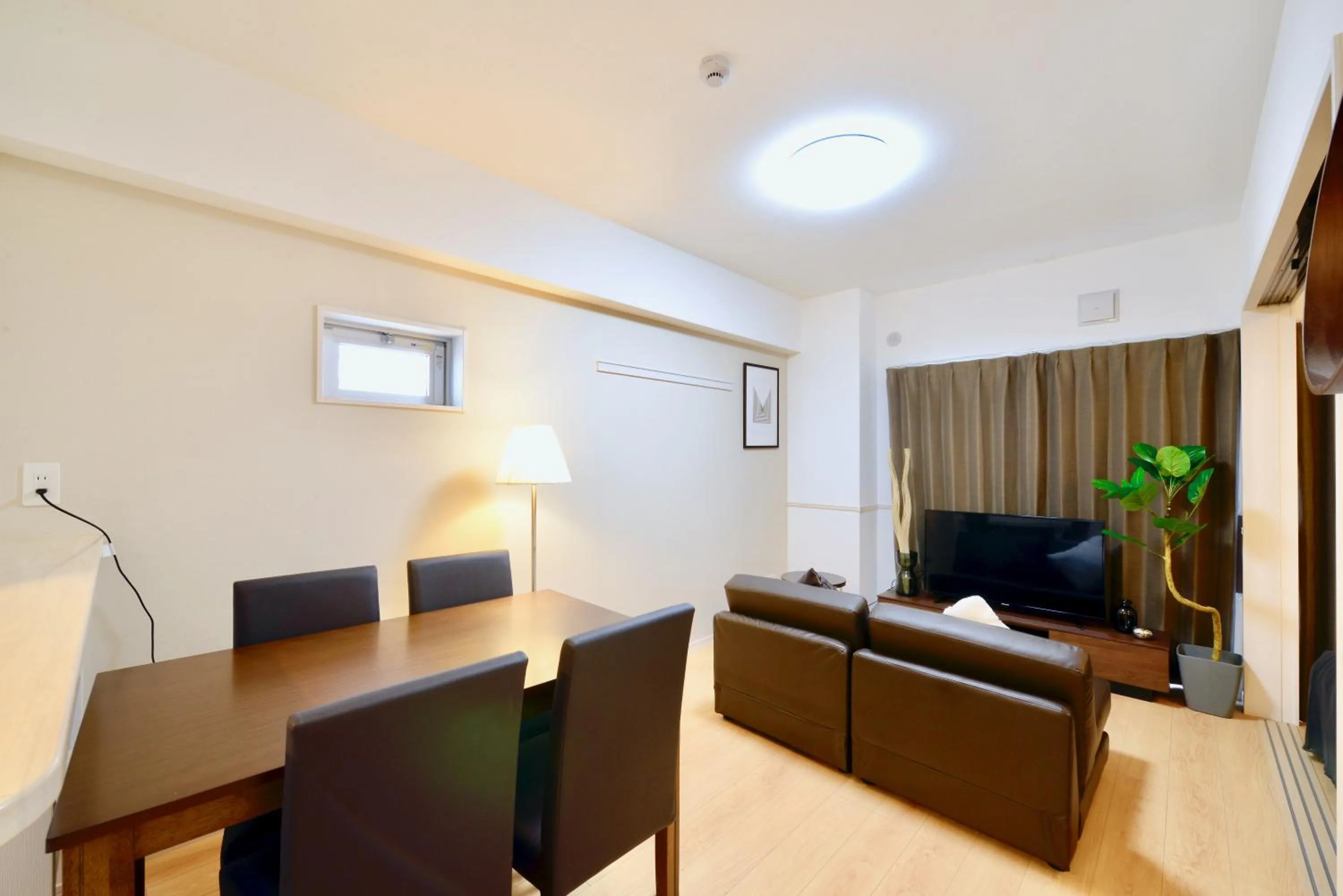 Communal lounge/ TV room in Allstay CHIBANA