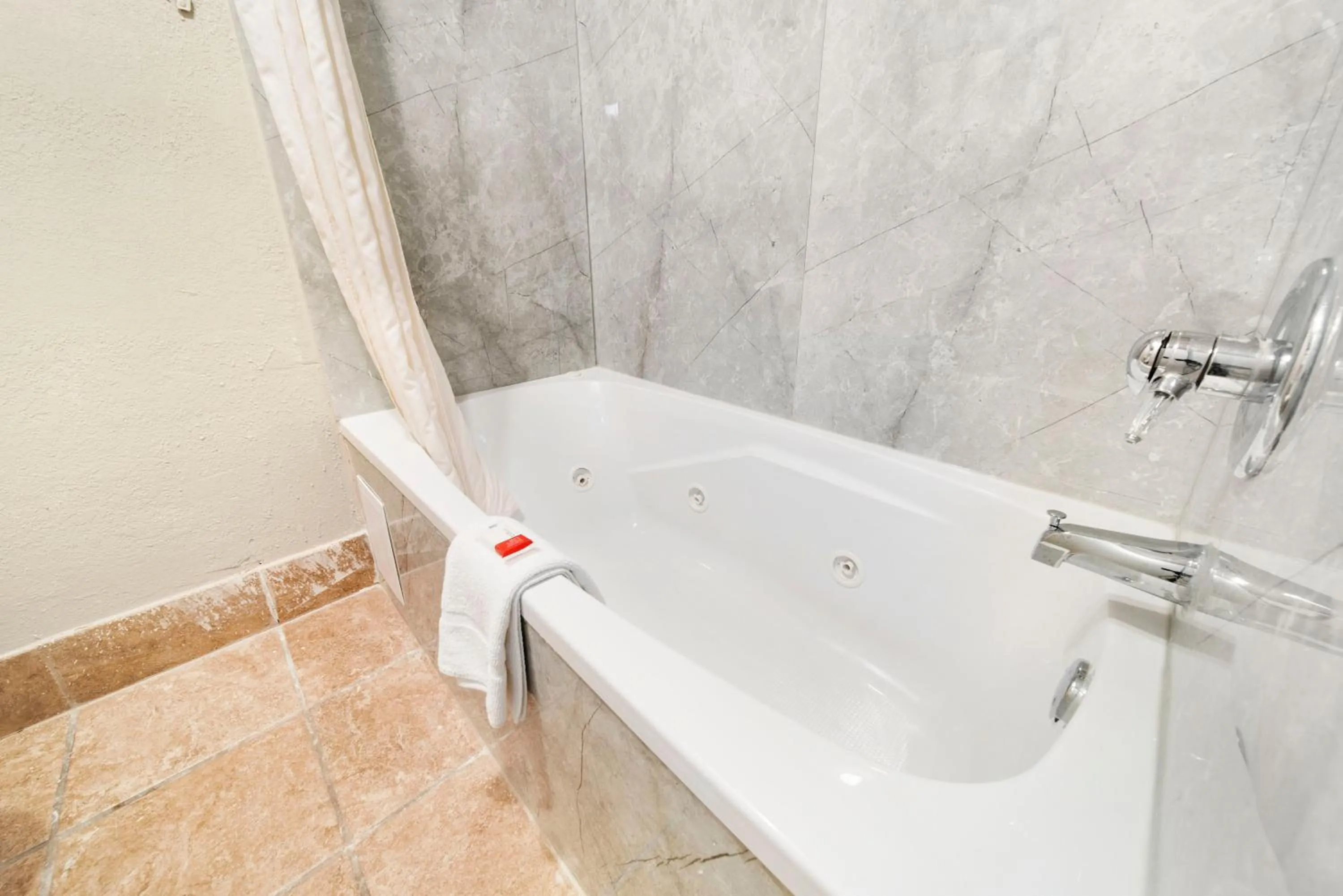 Bathroom in Baymont by Wyndham Muncie Near Ball State University