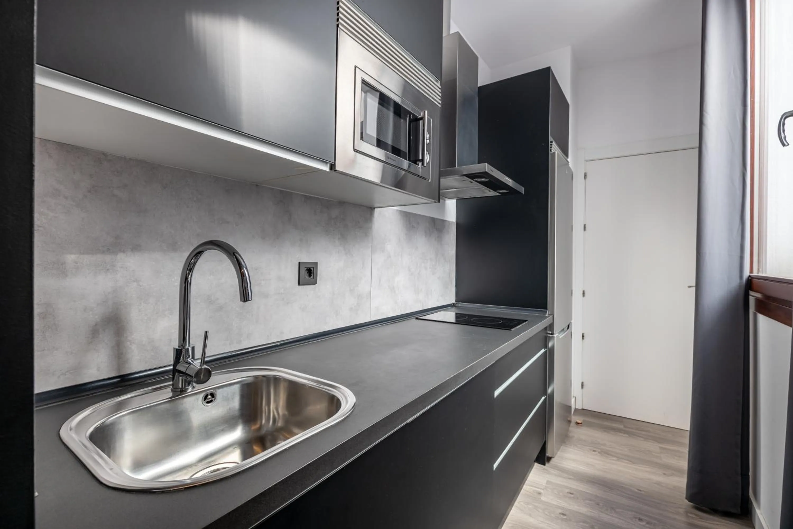 Kitchen or kitchenette in Apartamentos Granada Deluxe 3000