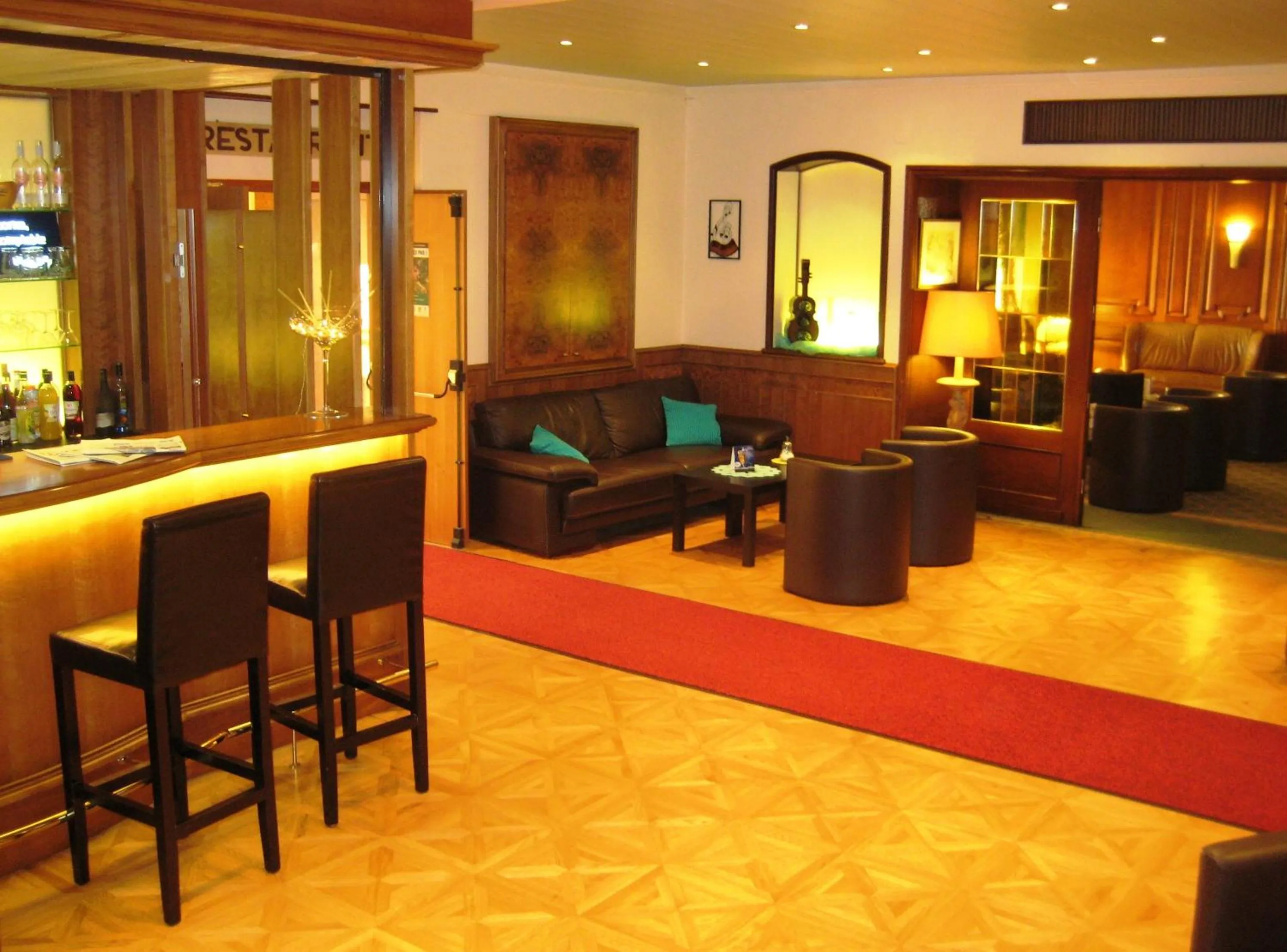 Living room in Logis Hôtel-Restaurant Aux Trois Roses