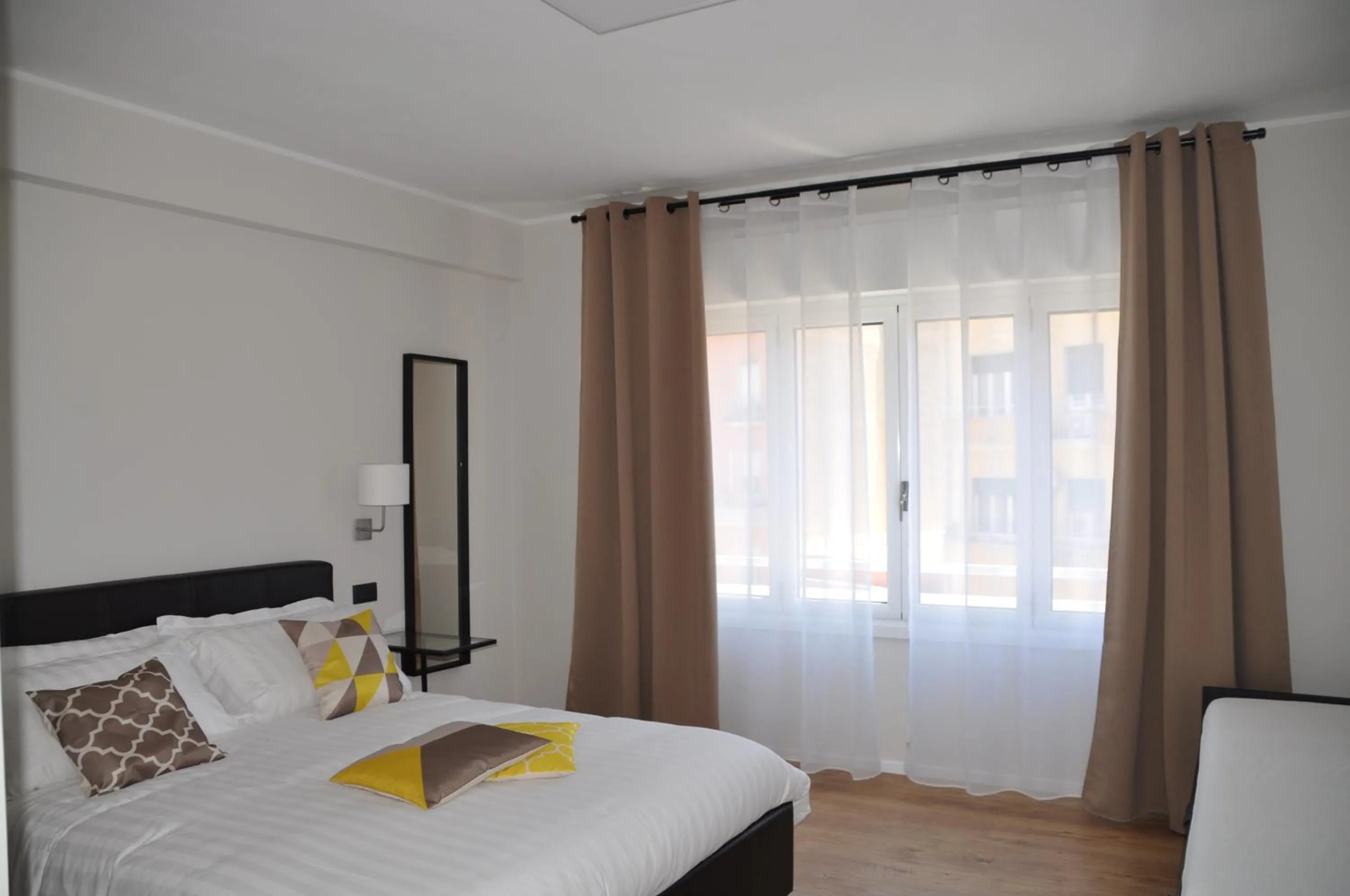 Bed in EVA LUXURY ROOMS CAGLIARI