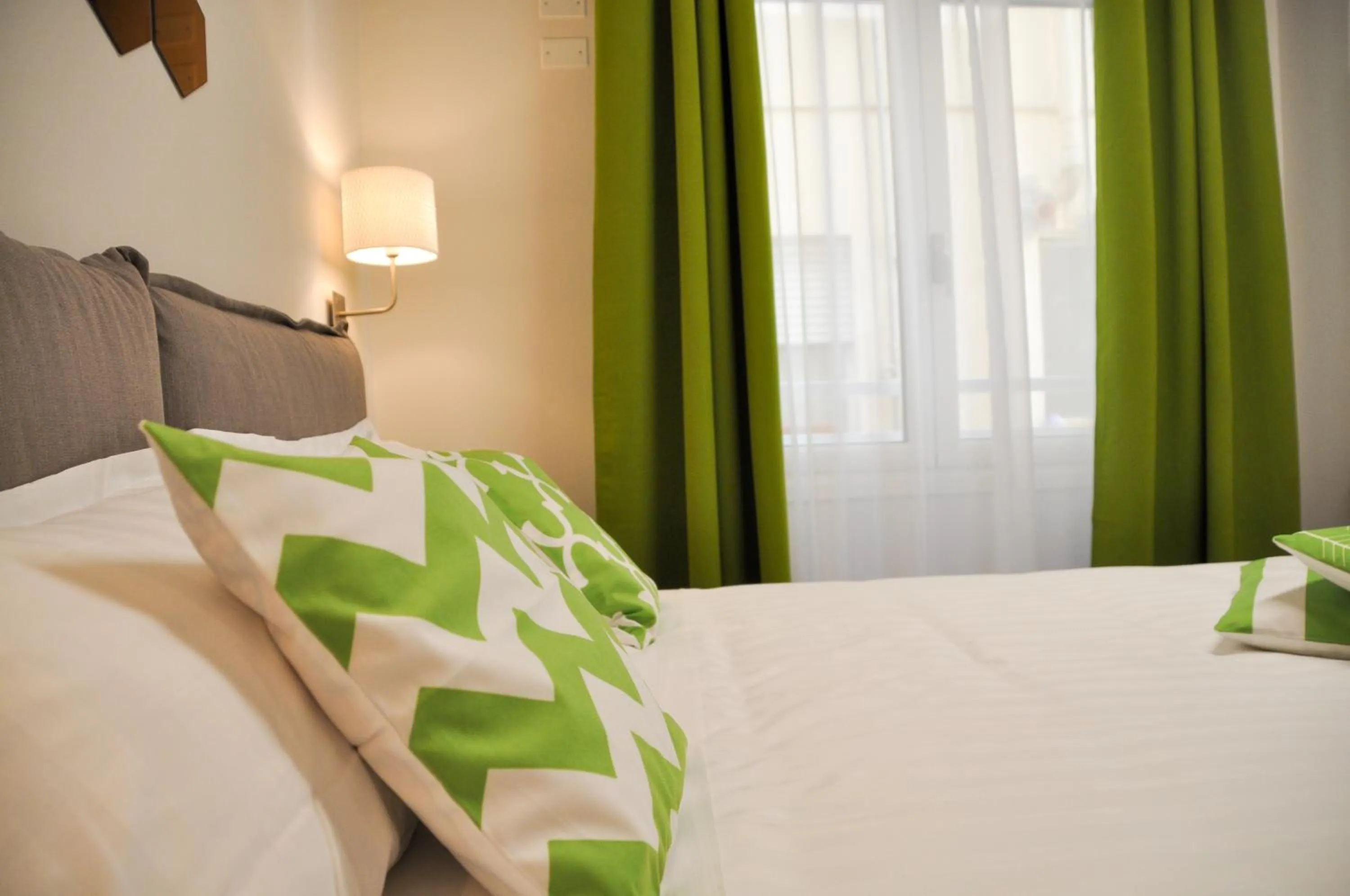 Bed in EVA LUXURY ROOMS CAGLIARI