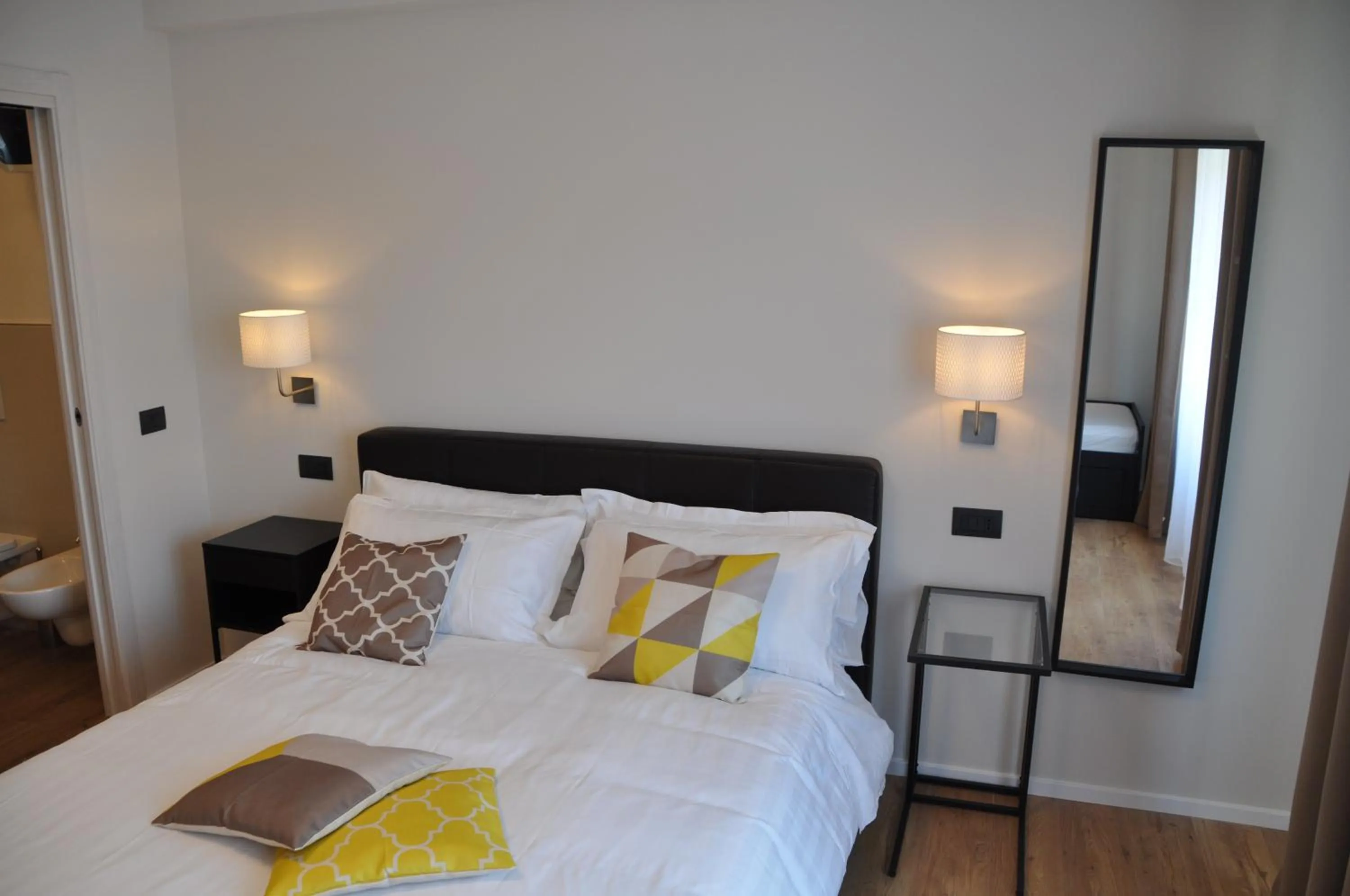 Bed in EVA LUXURY ROOMS CAGLIARI