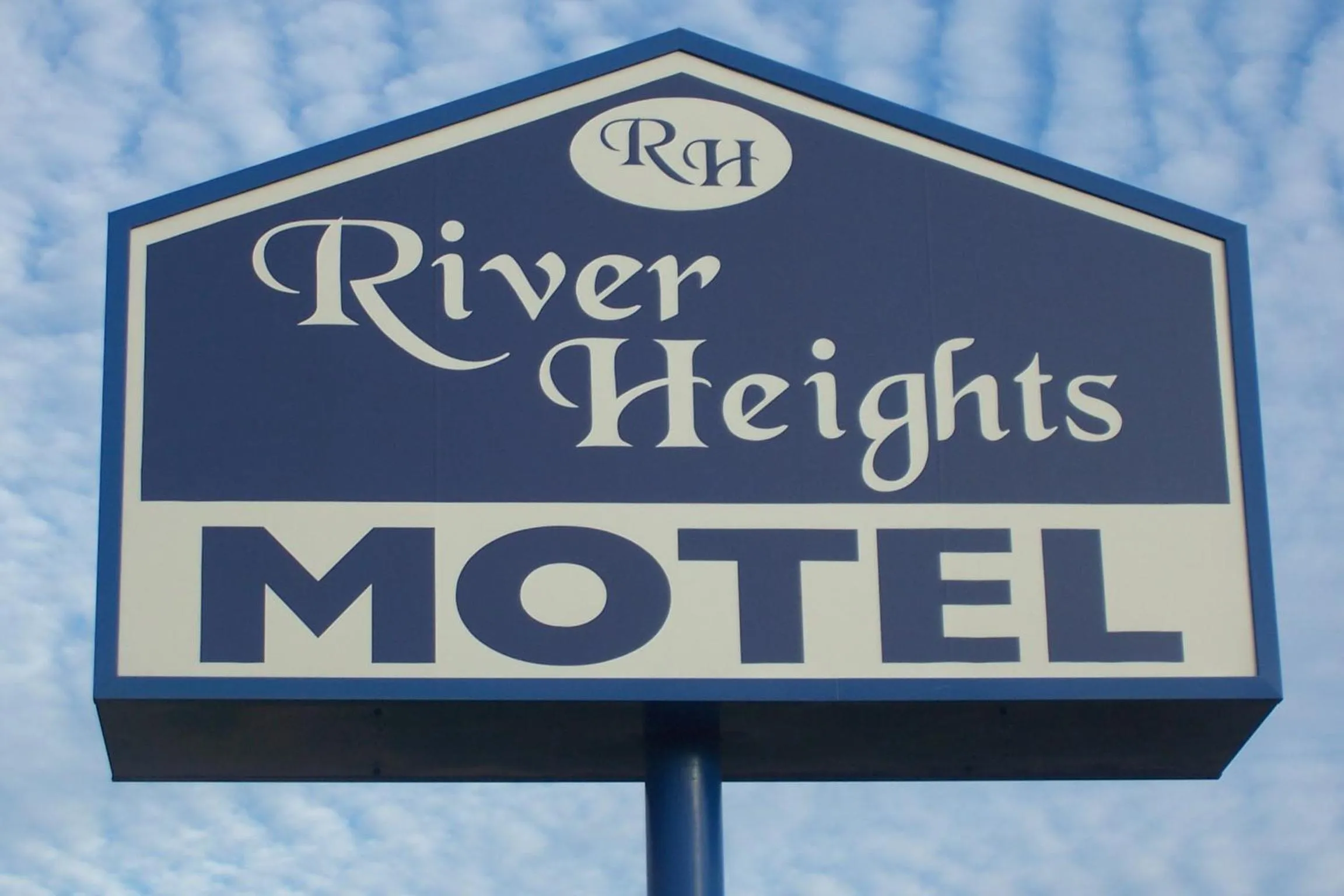 Property logo or sign in River Heights Motel