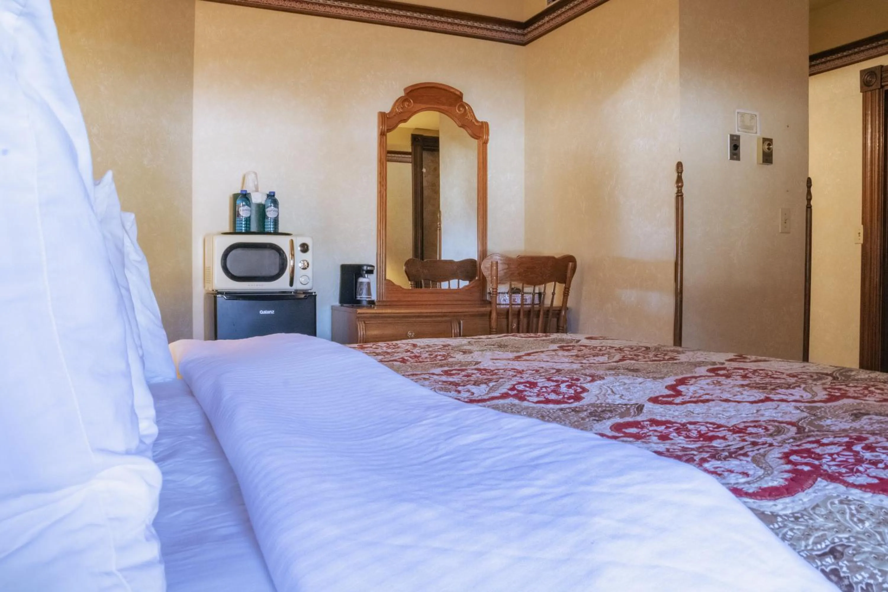 Bed in Historic Bullock Hotel