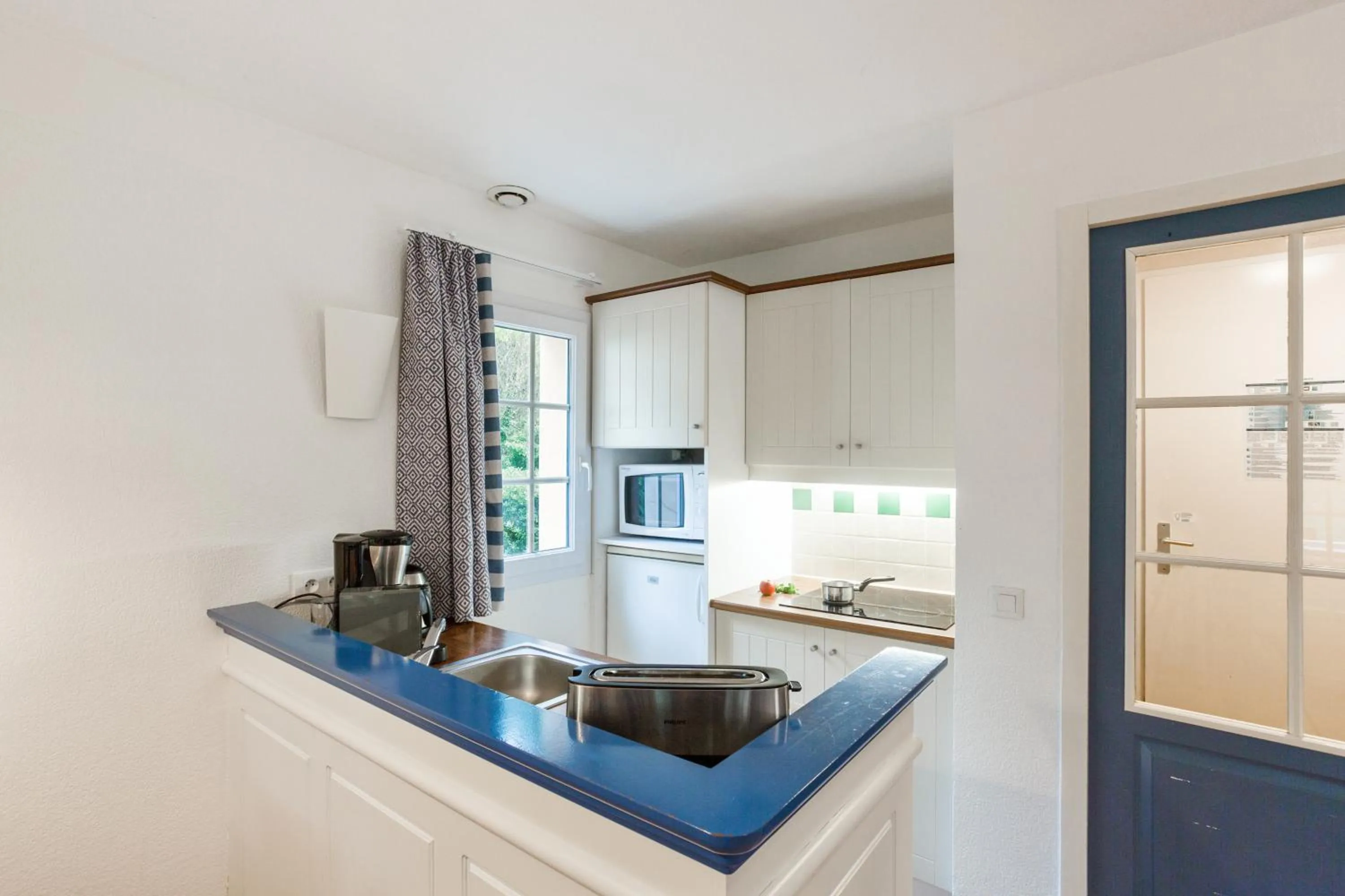 Kitchen or kitchenette in Village Pierre & Vacances Moliets