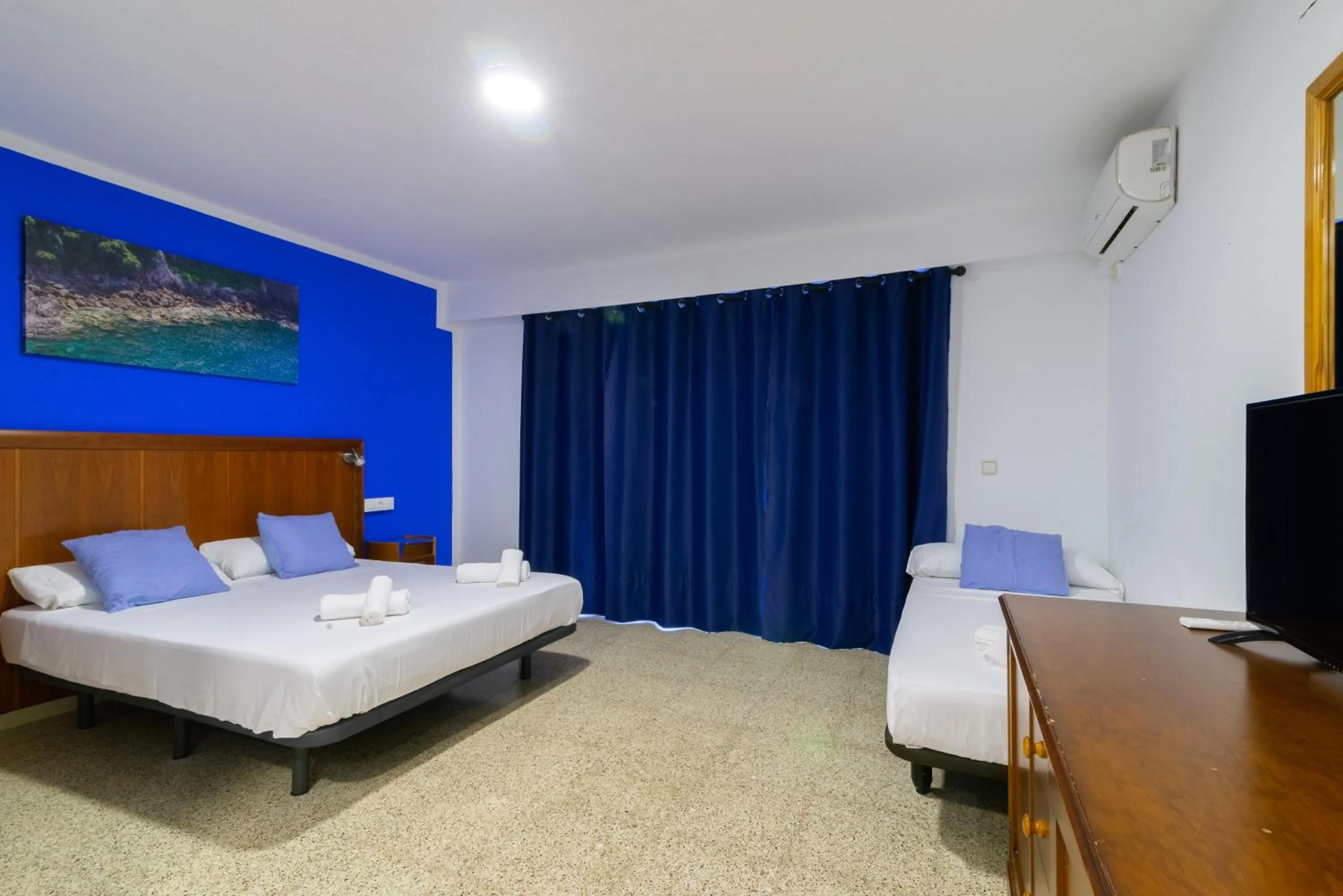 Bed in APARTAMENTOS PALASIET