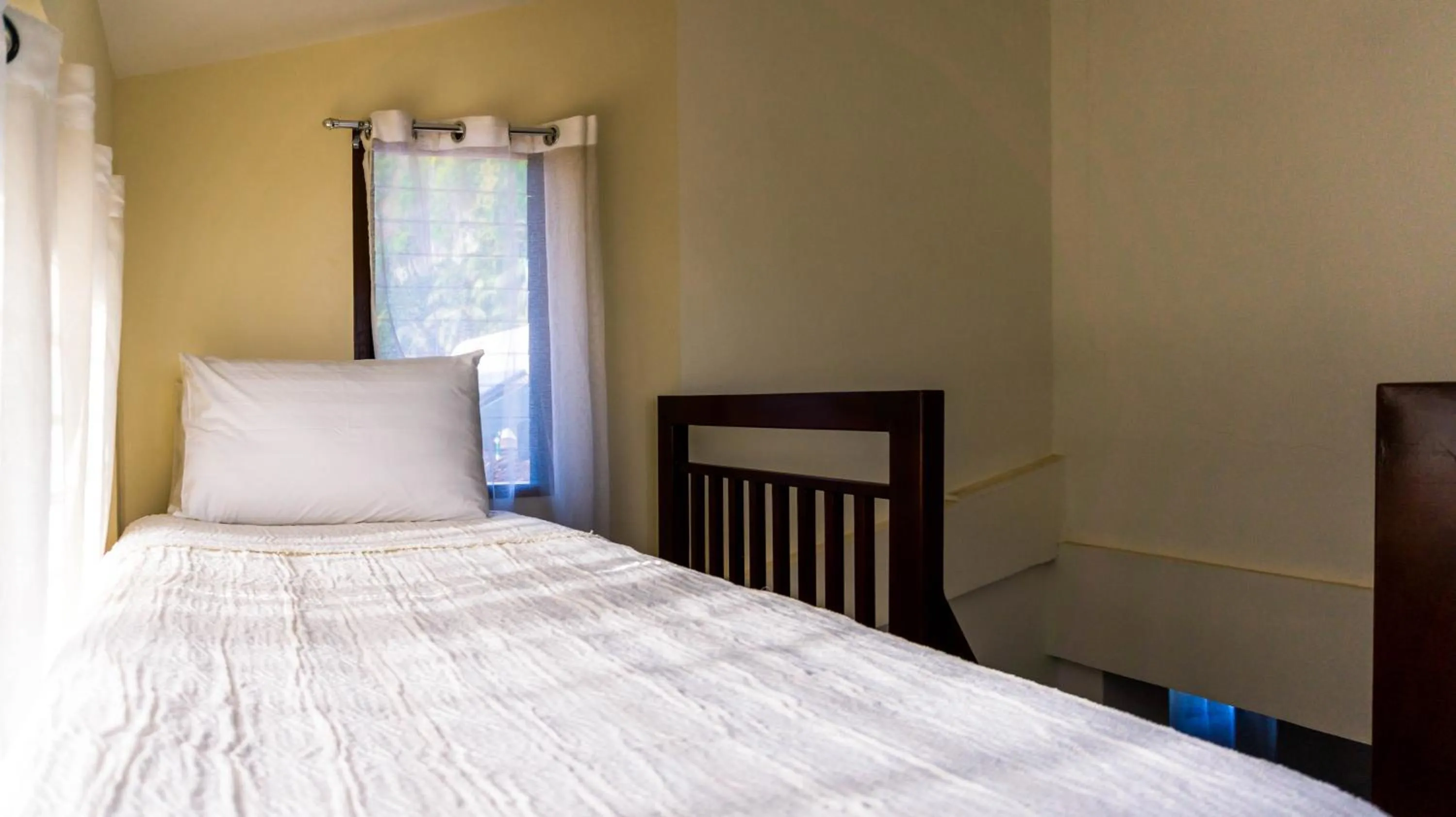 Bed in Talisay Boutique Hotel