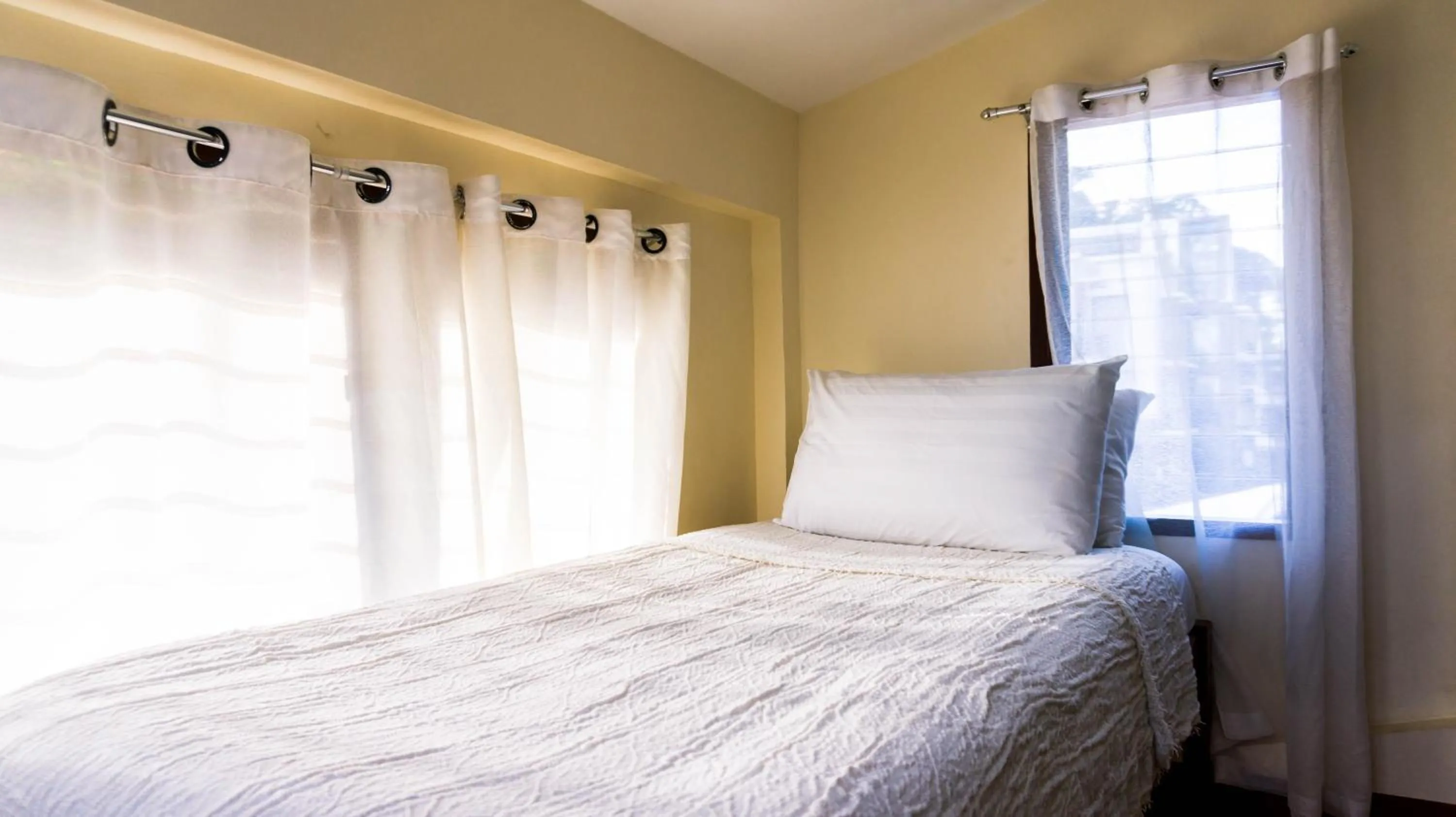 Bed in Talisay Boutique Hotel