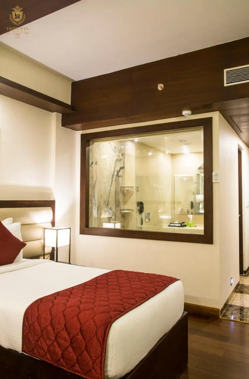 Bed in KPM TRIPENTA HOTEL