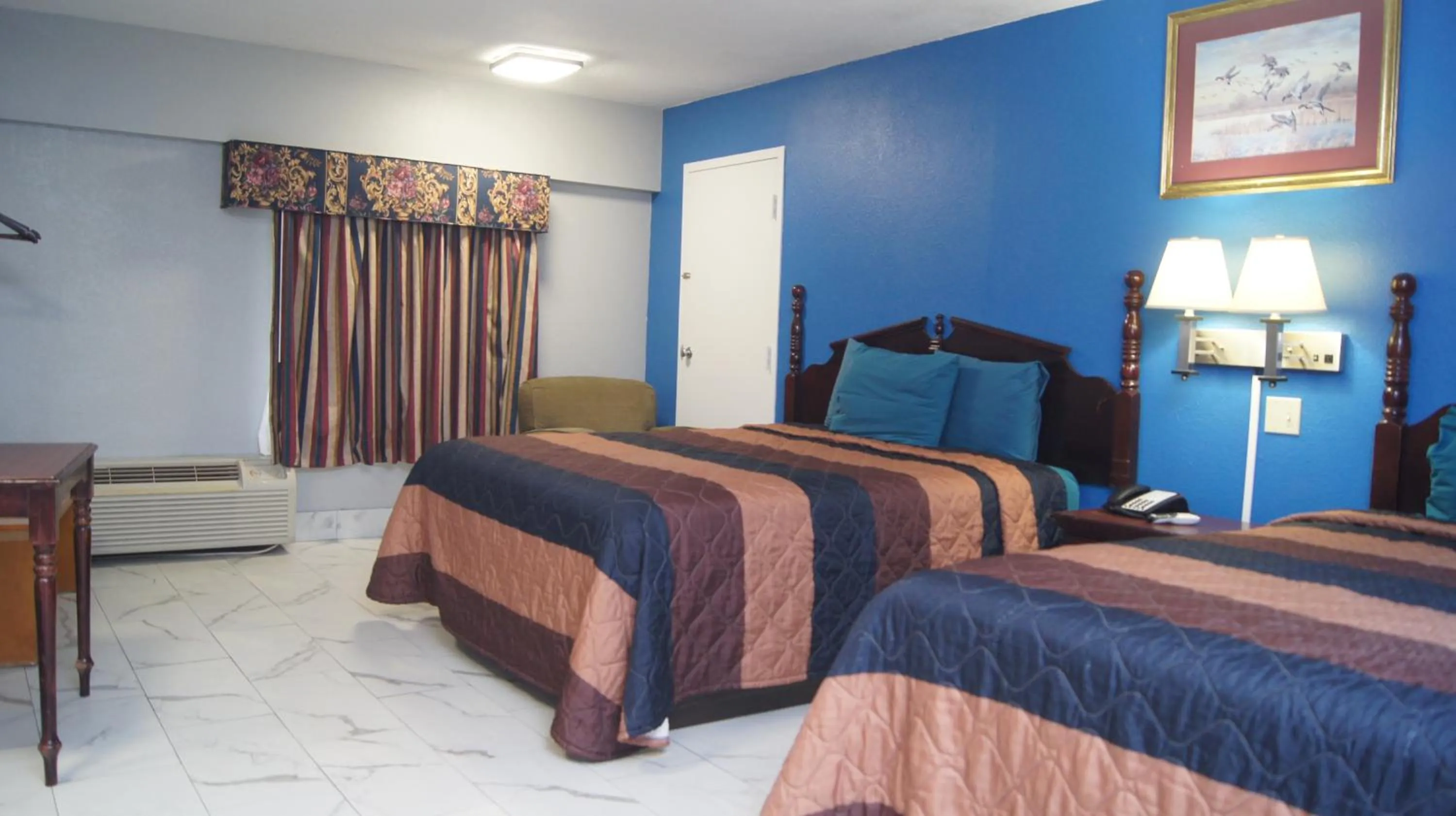 Bedroom in Holiday Lodge & Suites