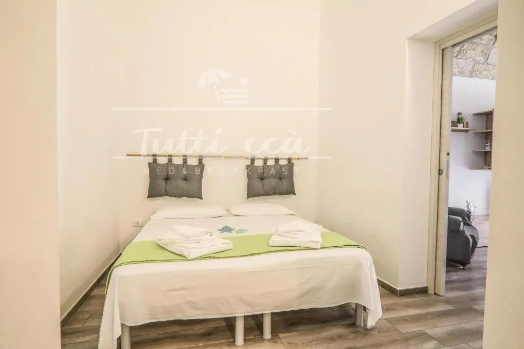 Bed in Tutti ccà Airport Rooms