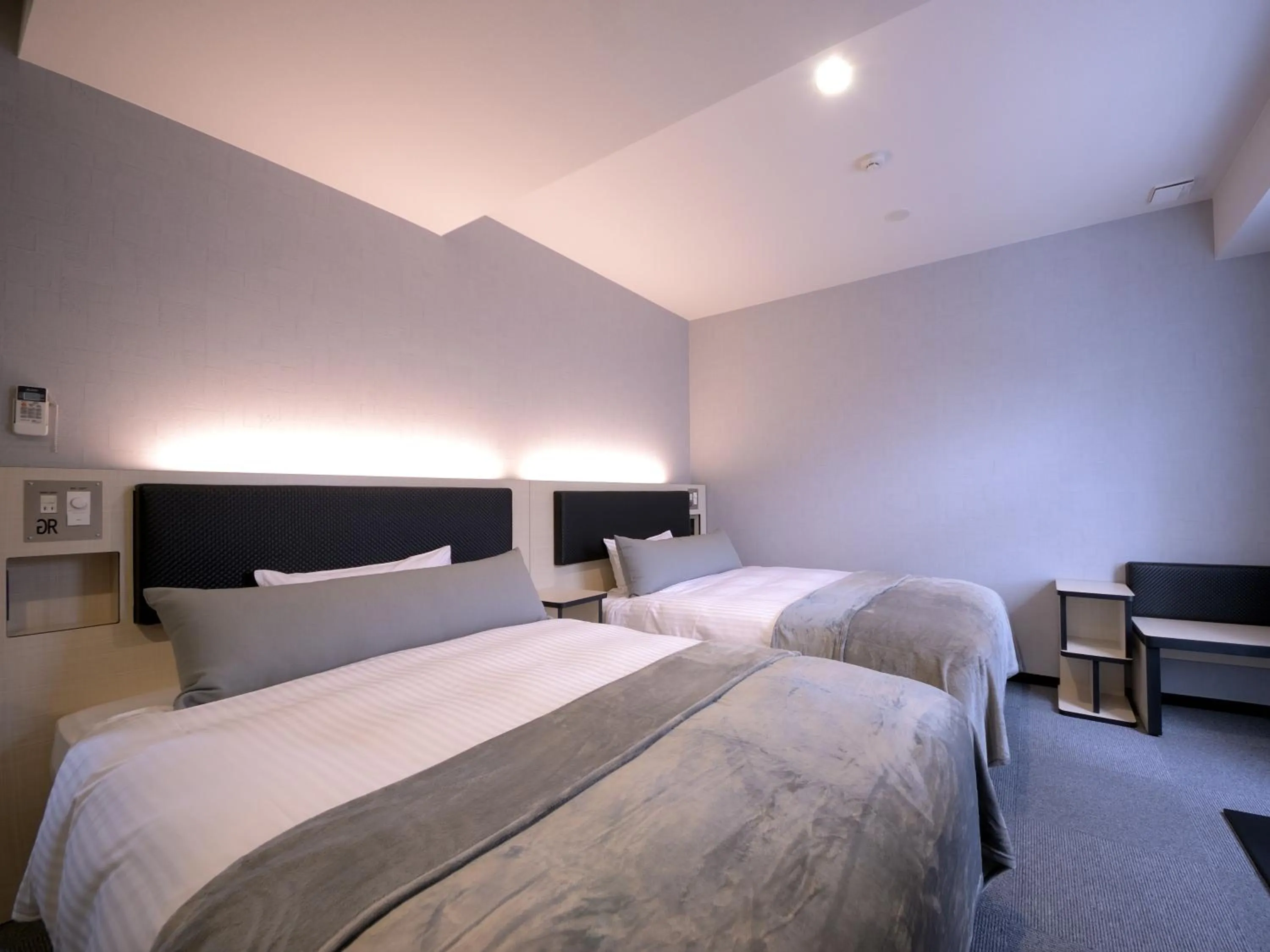 Bed in Green Rich Hotel Tottori Ekimae (Artificial hot spring Futamata Yunohana)