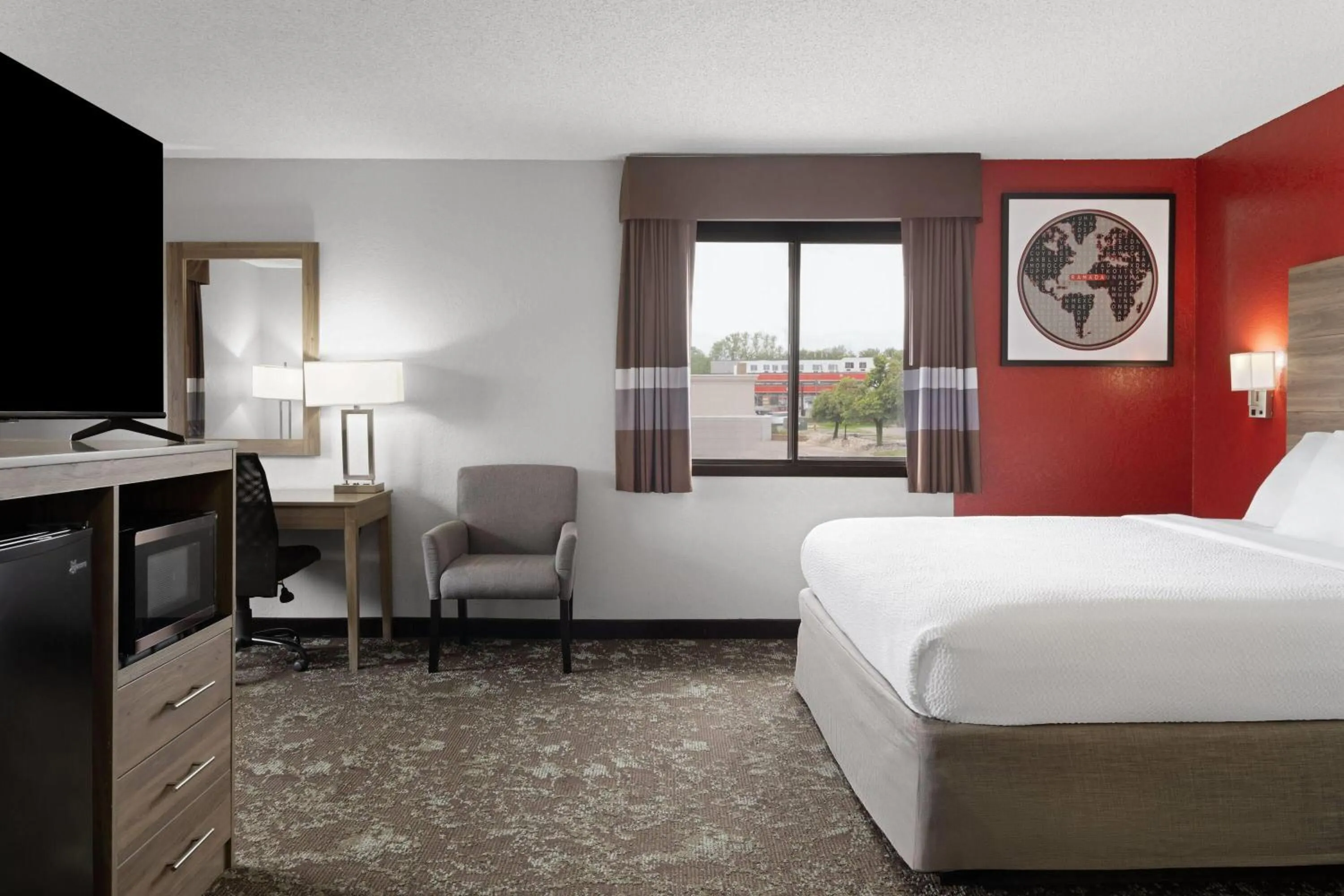 Photo of the whole room, Bed in Ramada by Wyndham Cedar Rapids South