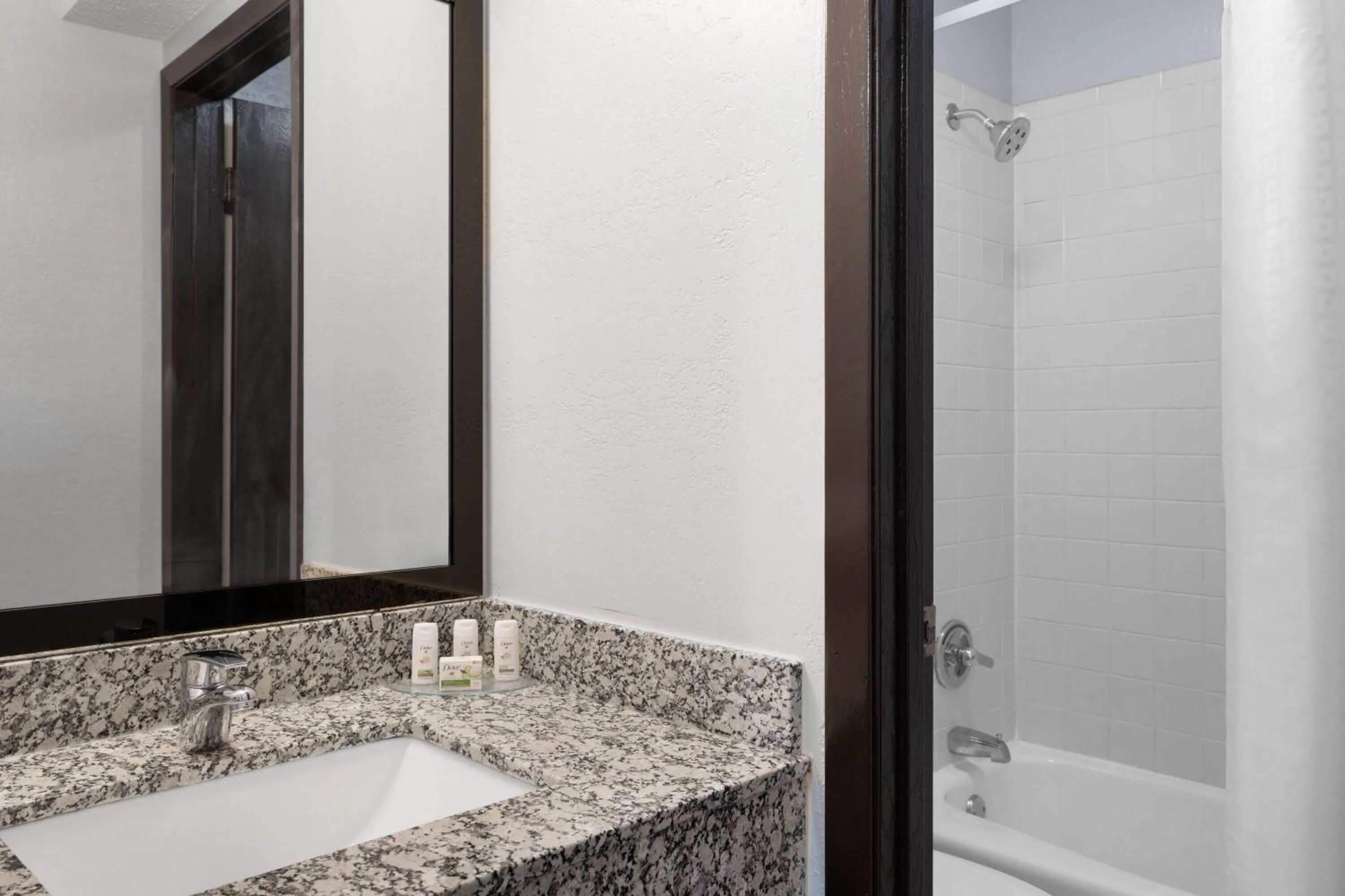 Bathroom in Ramada by Wyndham Cedar Rapids South