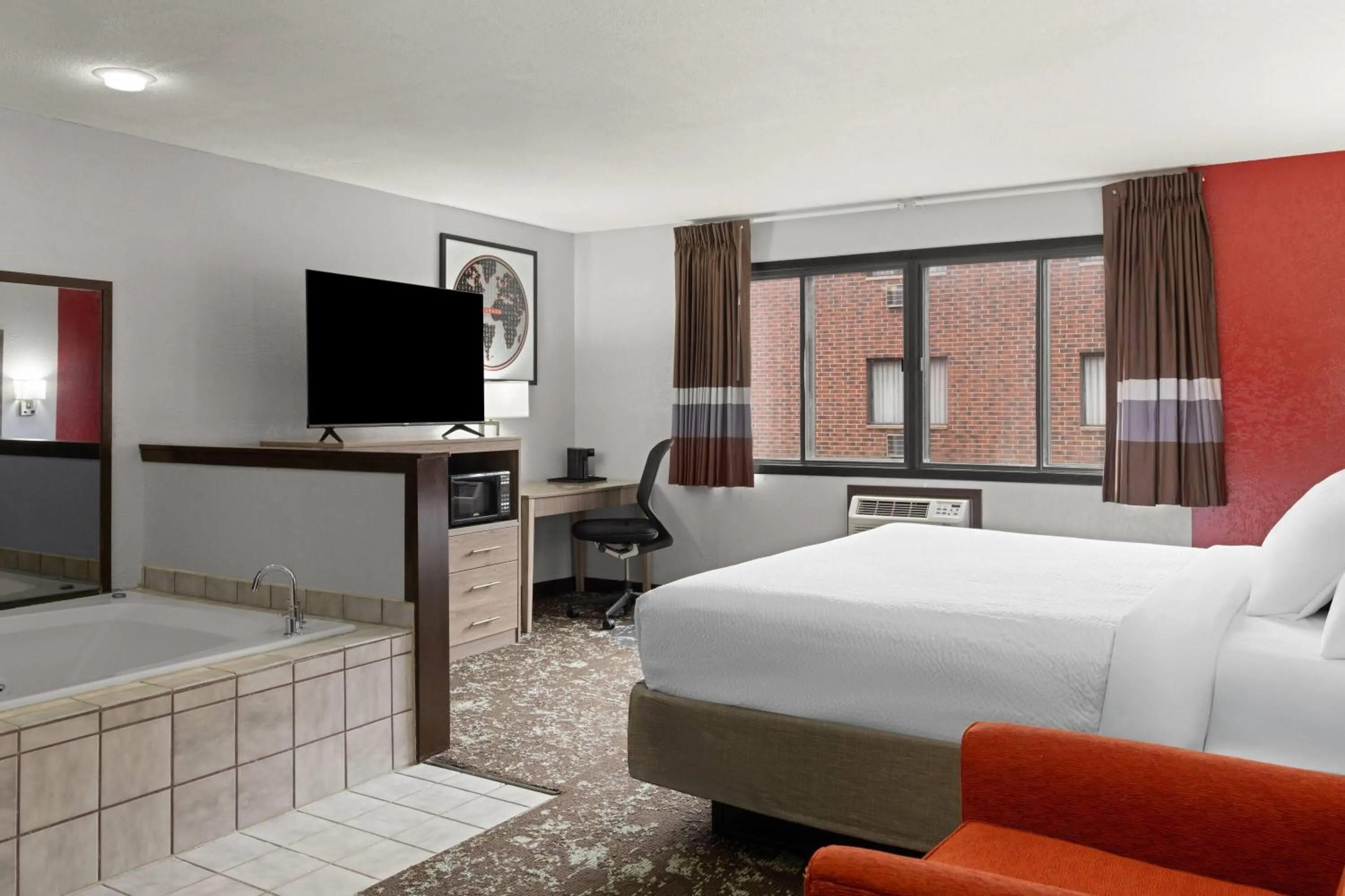 Photo of the whole room, Bed in Ramada by Wyndham Cedar Rapids South