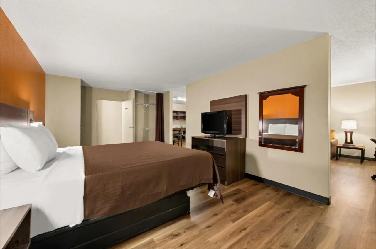 Bed in Suburban Studios Winston-Salem near Hanes Mall