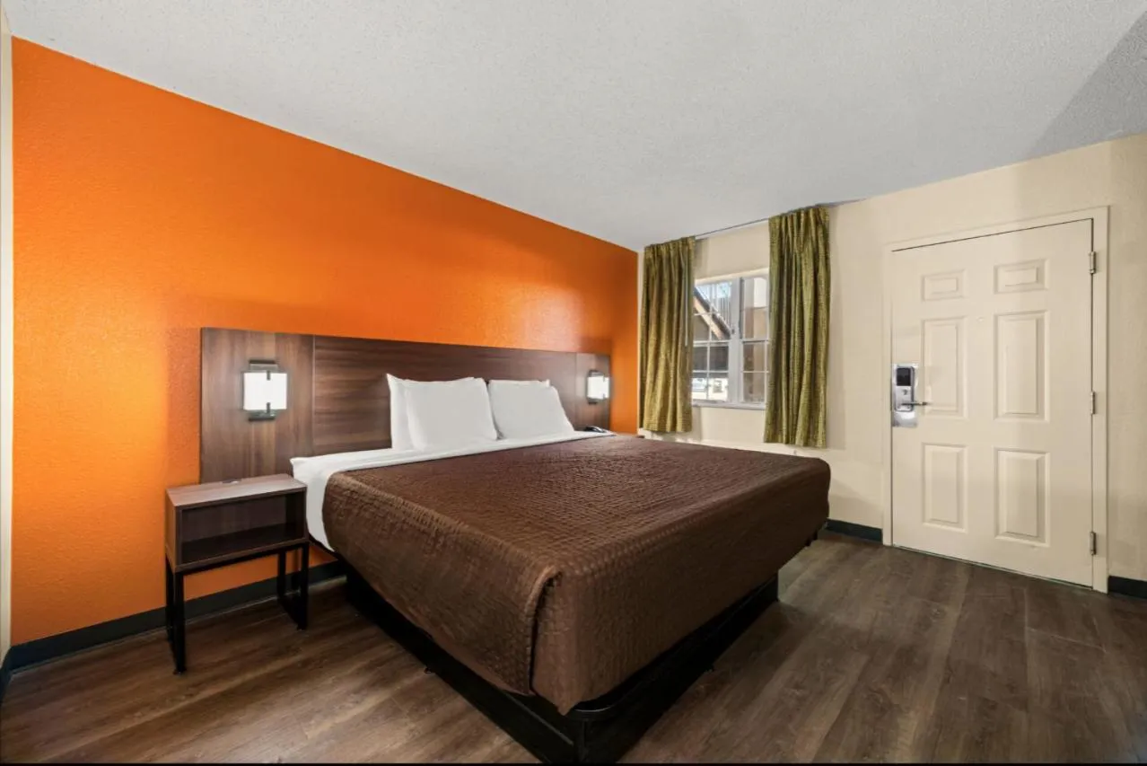 Bed in Suburban Studios Winston-Salem near Hanes Mall