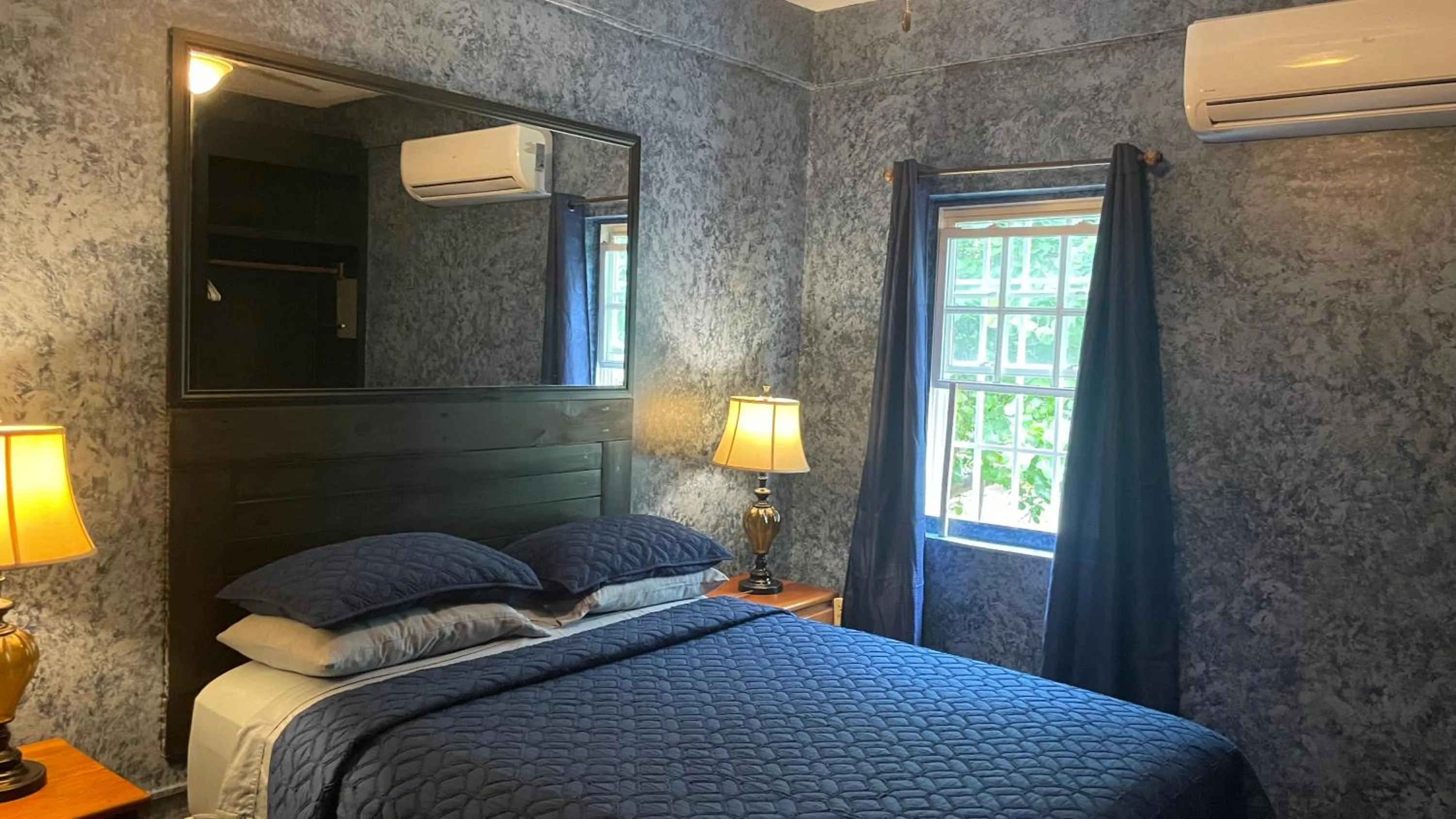 Bed in Belize Budget Suites