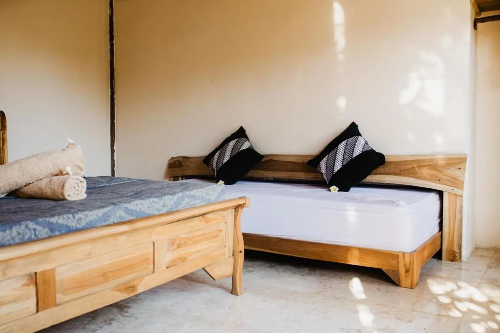 Bed in Kalyssa Beach Bungalows