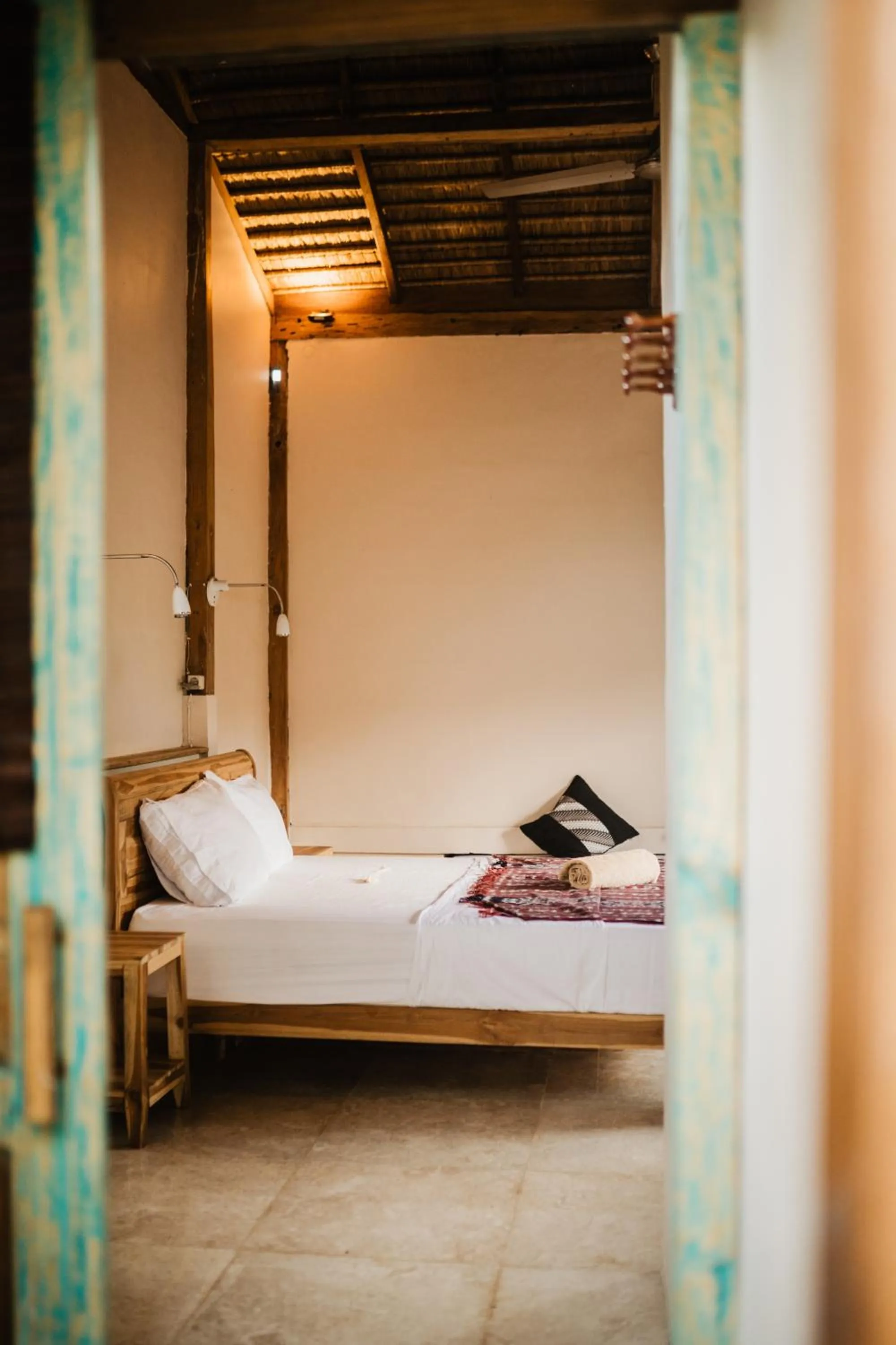 Bed in Kalyssa Beach Bungalows