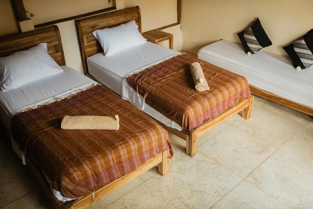 Bed in Kalyssa Beach Bungalows