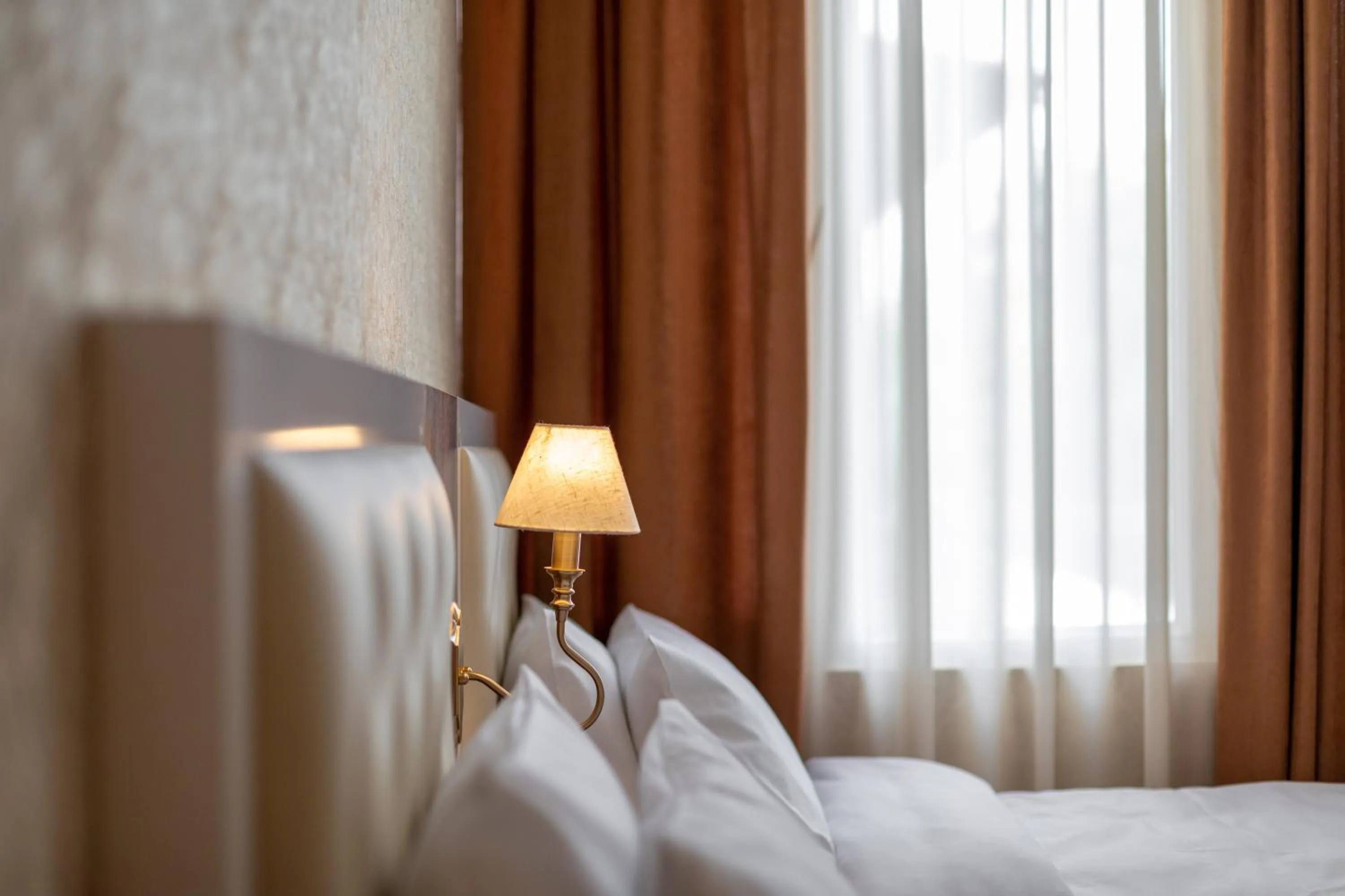 Bed in Ornament Hotel