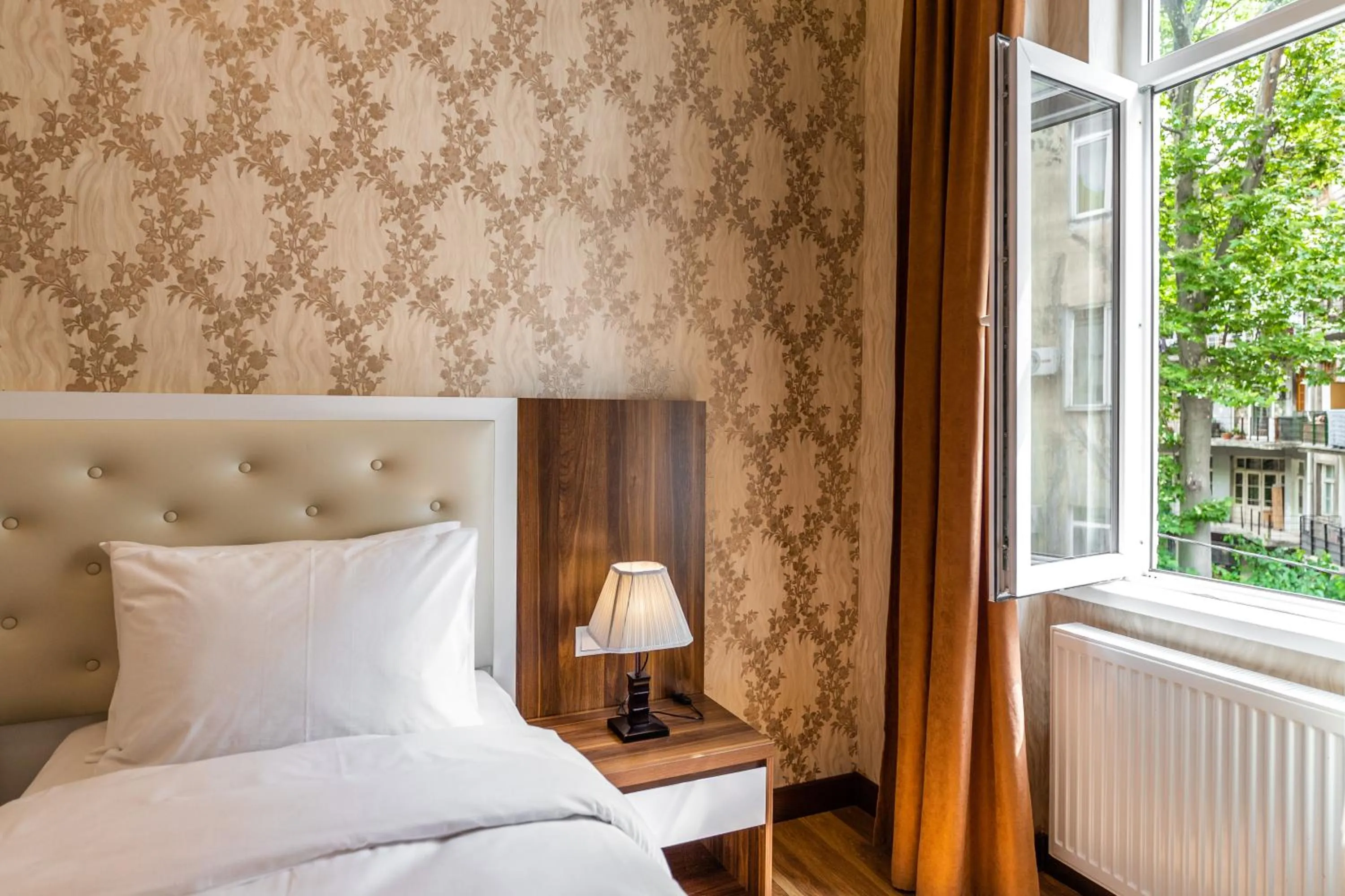 Bed in Ornament Hotel