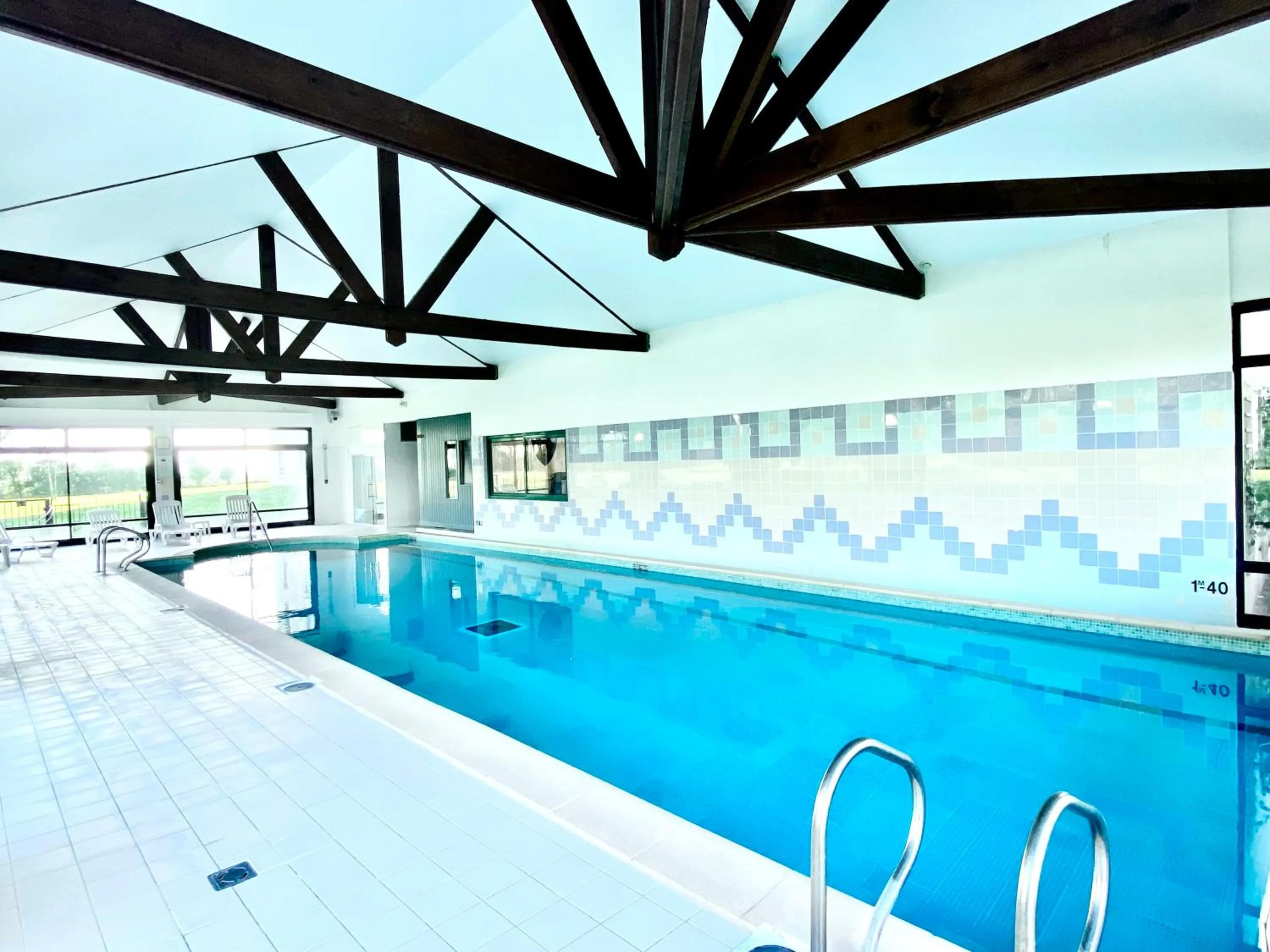 Swimming pool in Holiday Inn Calais Coquelles by IHG