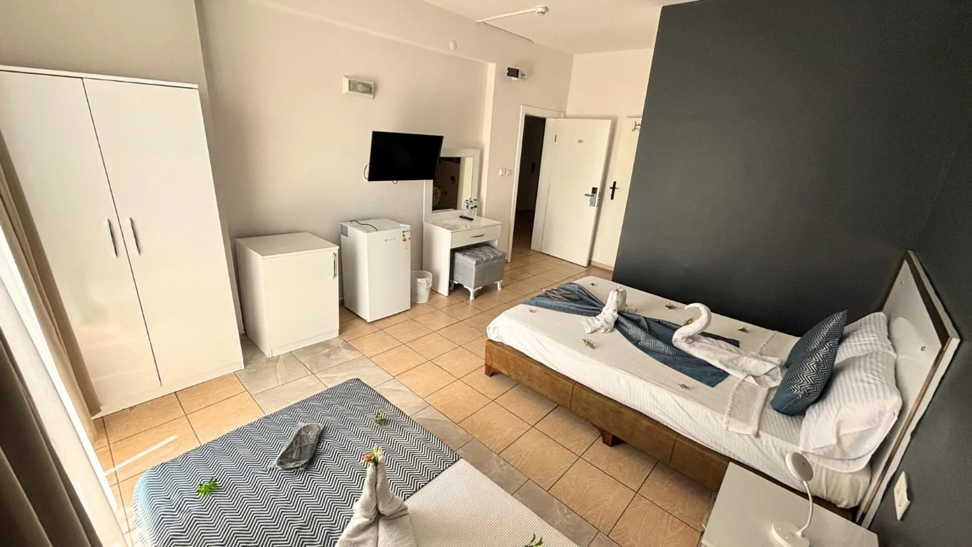 Bed in MOONBOW BEACH HOTEL