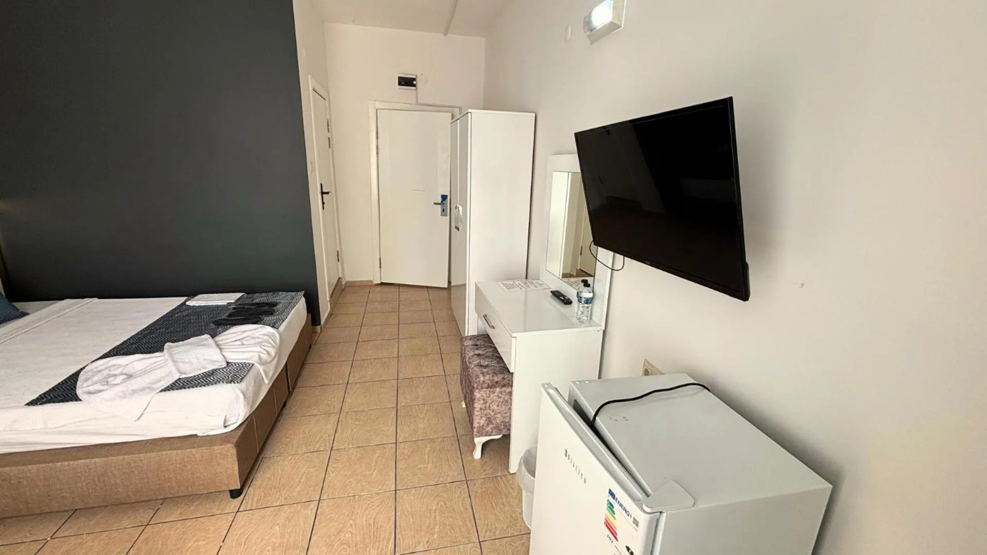 Bed in MOONBOW BEACH HOTEL