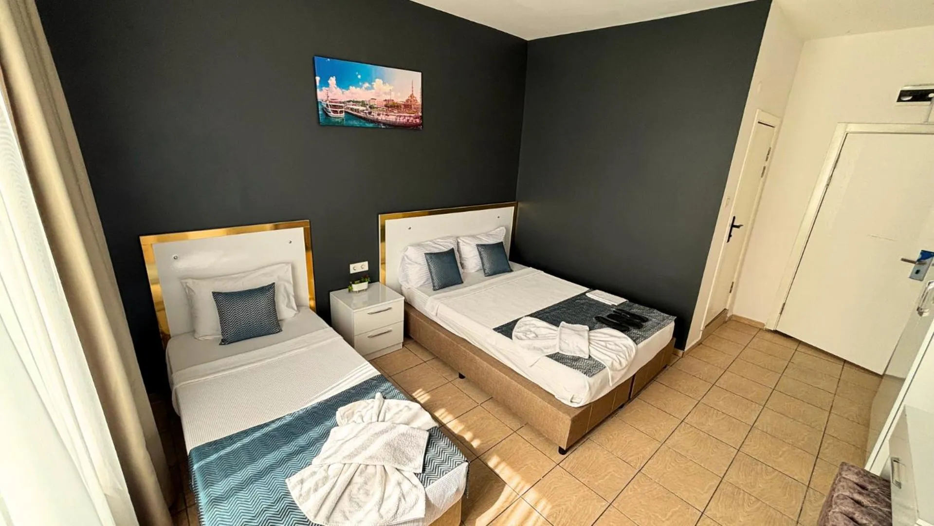 Bed in MOONBOW BEACH HOTEL