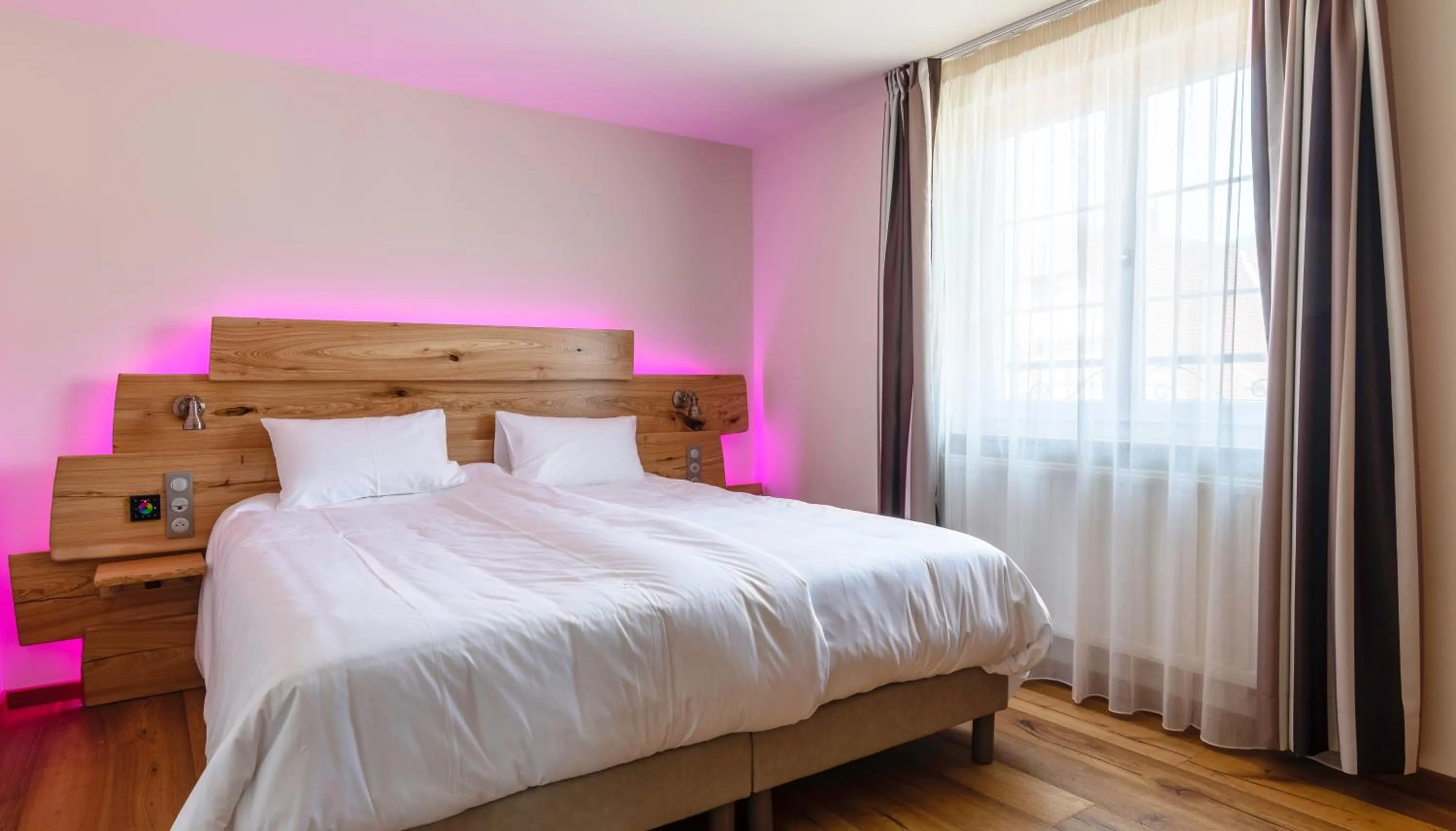 Bed in Logis Hotel Restaurant Keimberg