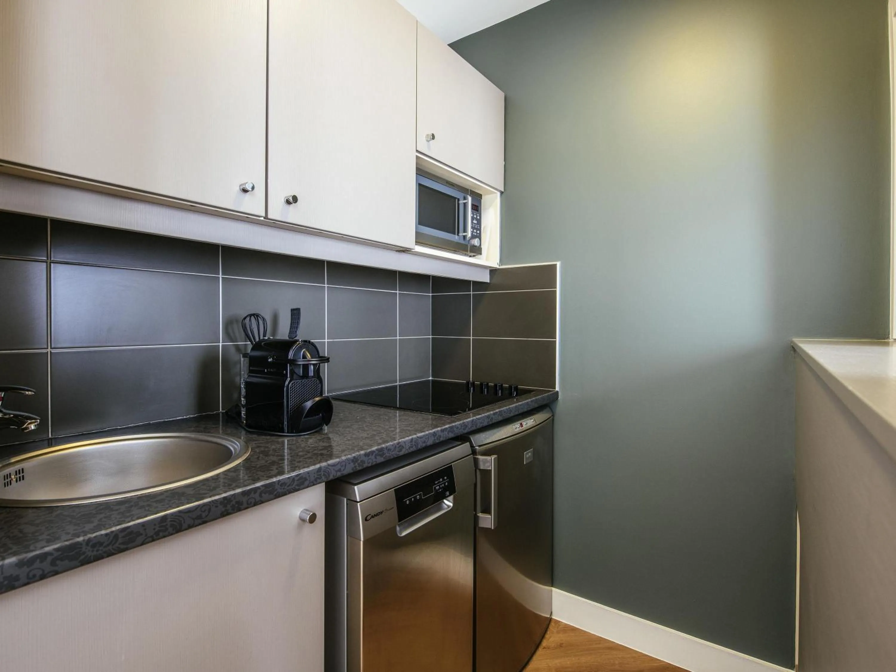 Bedroom in Aparthotel Adagio Paris Buttes Chaumont