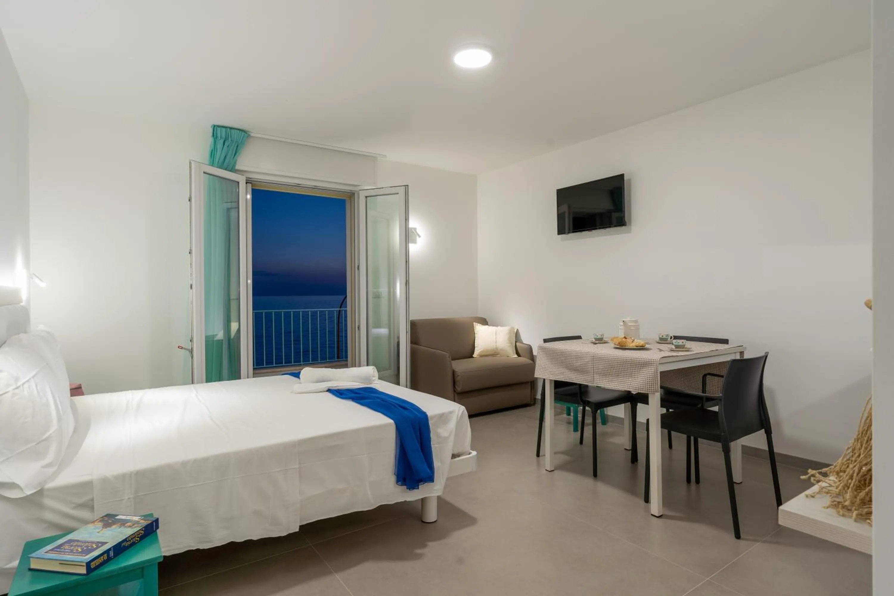 Bed in SMERALDO RESIDENCE