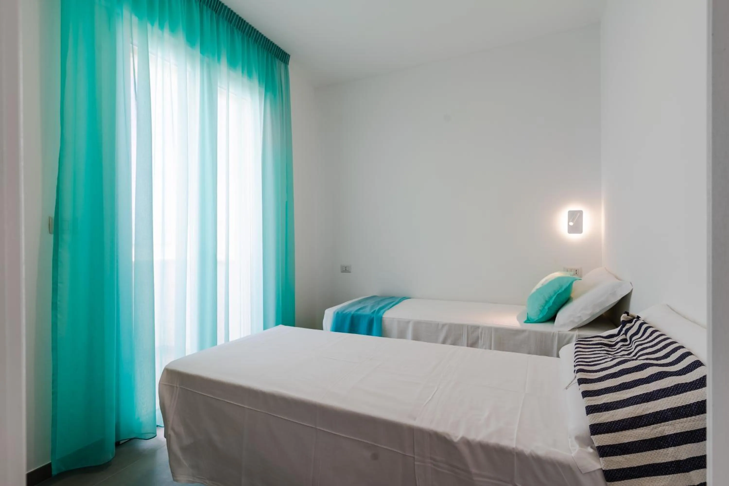 Bed in SMERALDO RESIDENCE