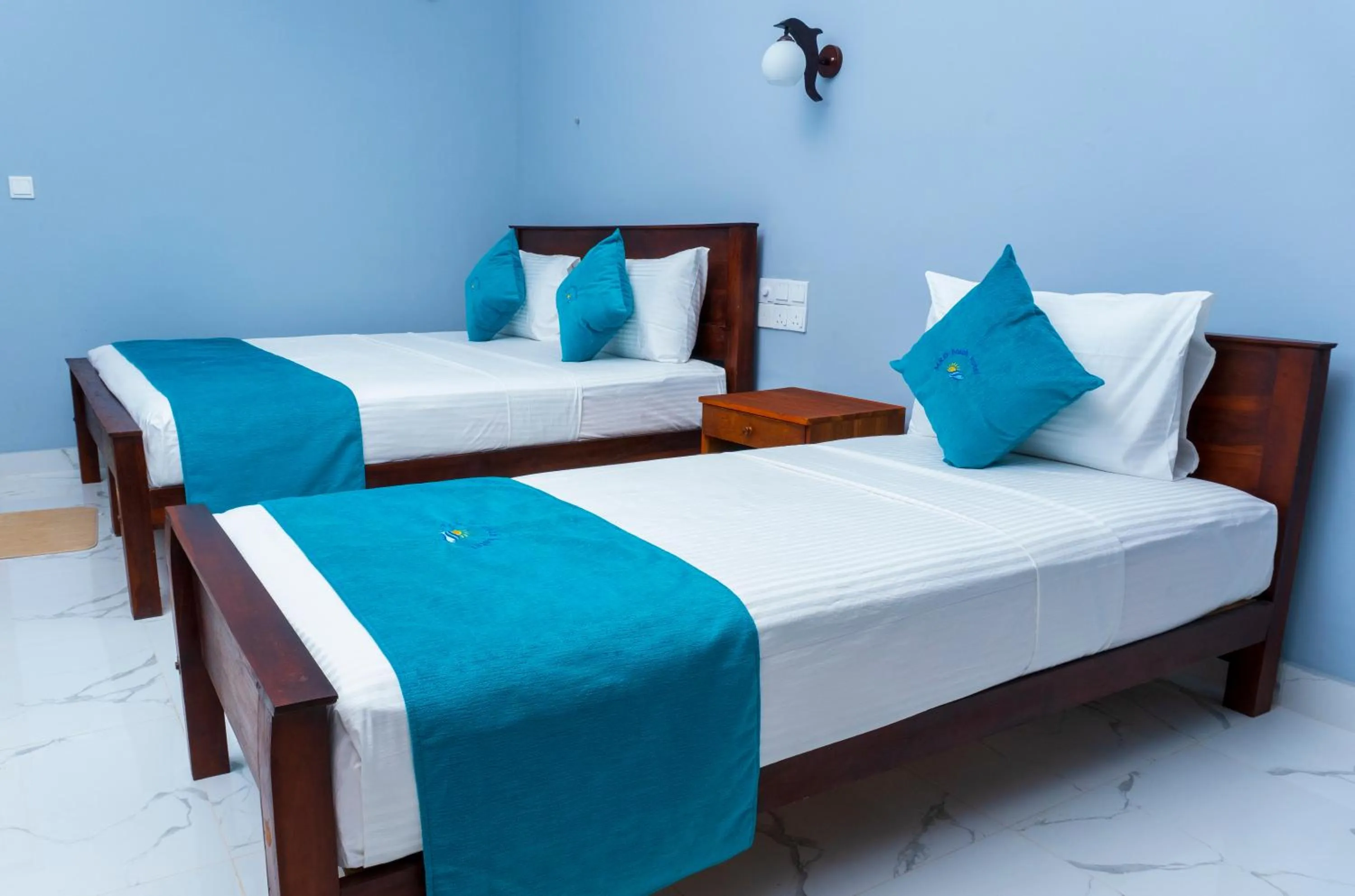 Bed in MRD Beach Hotel